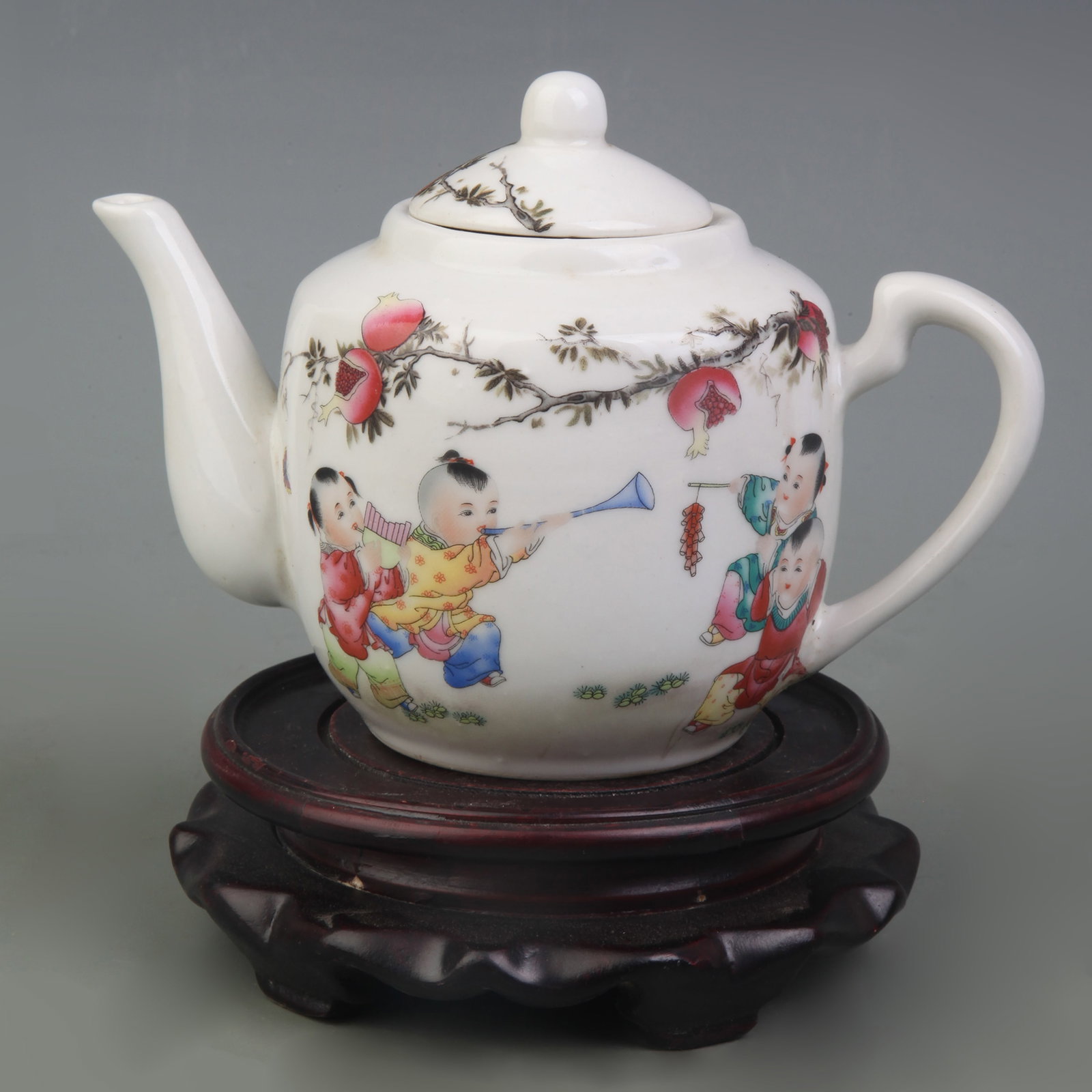 FAMILLE ROSE TEAPOT WITH FIGURE MOTIF: Republic Period; Width: 6.6 inch; High: 4.3 inch; Wooden base for picture and display only.
