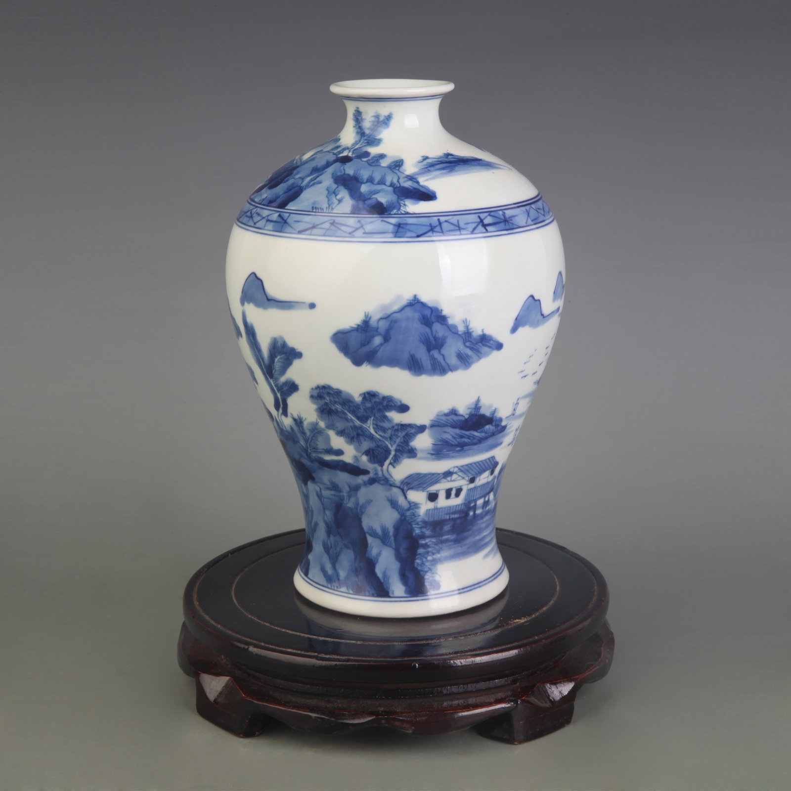 A BLUE AND WHITE MEIPING VASE WITH LANDSCAPE DECORATION: Qing Dynasty; Diameter: 3.2 inch; High: 7.7 inch; Wooden base for picture and display only.