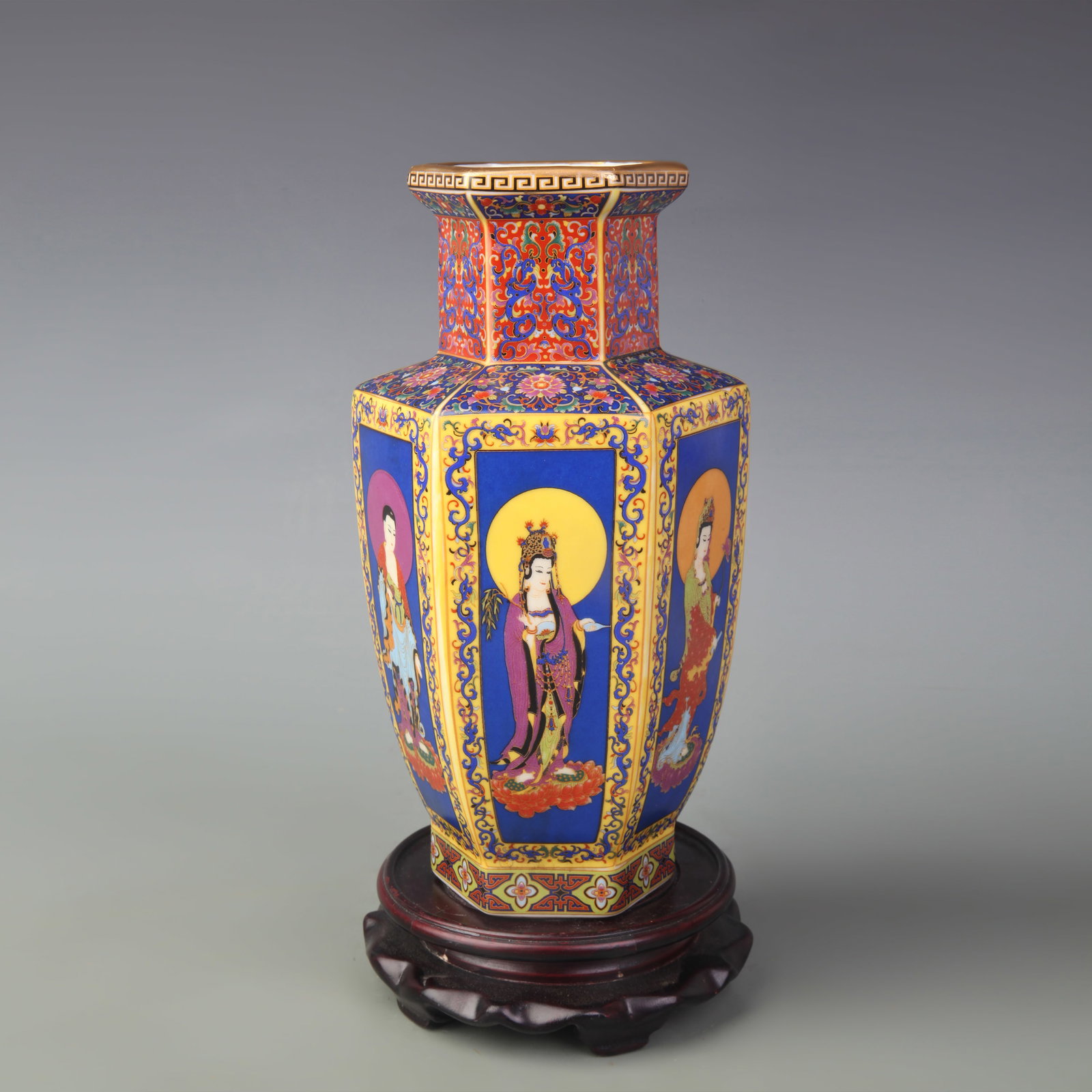 A FINE ENAMEL-PAINTED PORCELAIN HEXAGONAL VASE: Qing Dynasty; High: 9.1 inch; Wooden base for picture and display only.