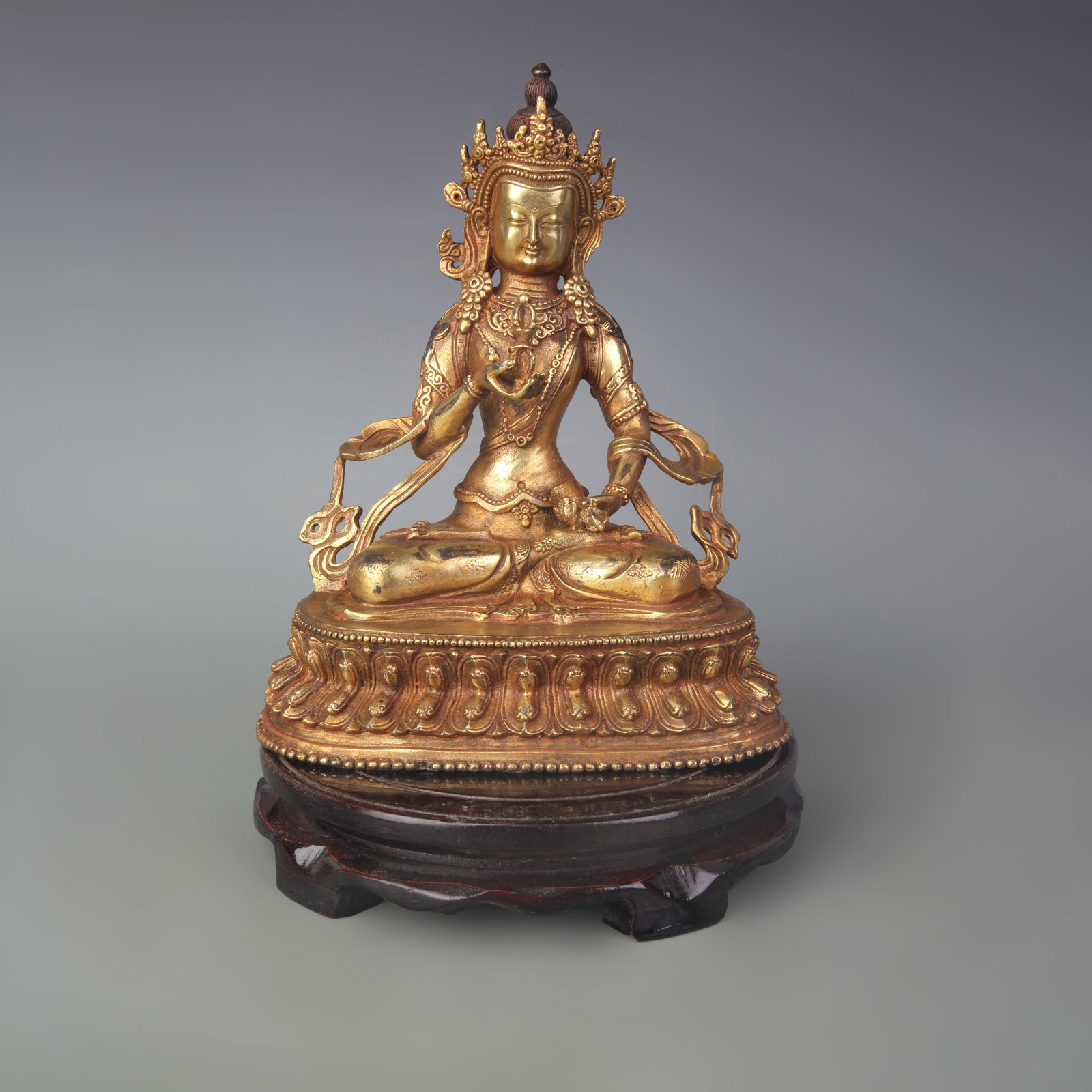 A FINE GILT-BRONZE VAJRASATTVA STATUE: Qing Dynasty; Width: 6.7 inch; High:8.3 inch; Wooden base for picture and display only.
