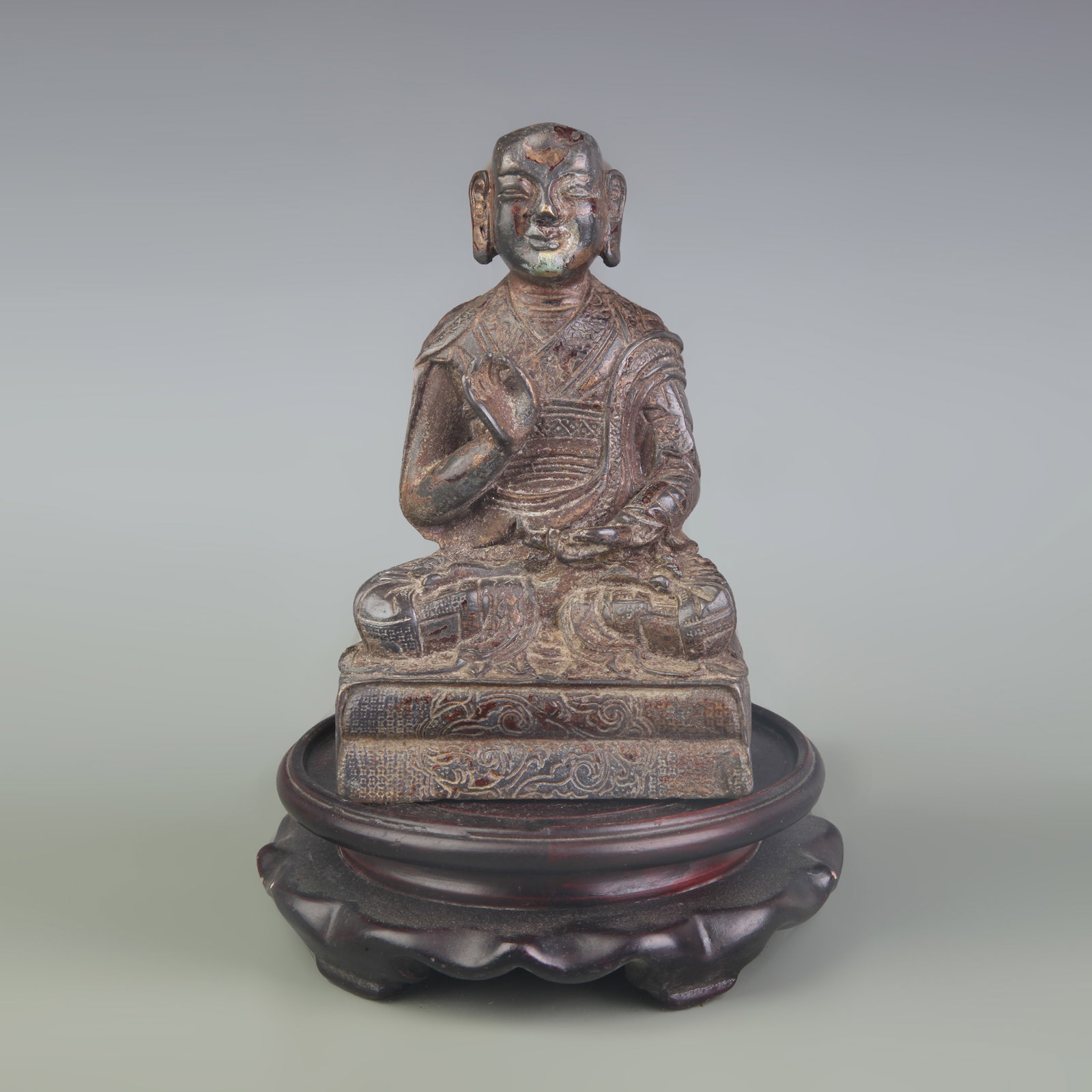 A FINE GILT-BRONZE ARHAT STATUE: Qing Dynasty; Width: 3.4 inch; High:5.5 inch; Wooden base for picture and display only.