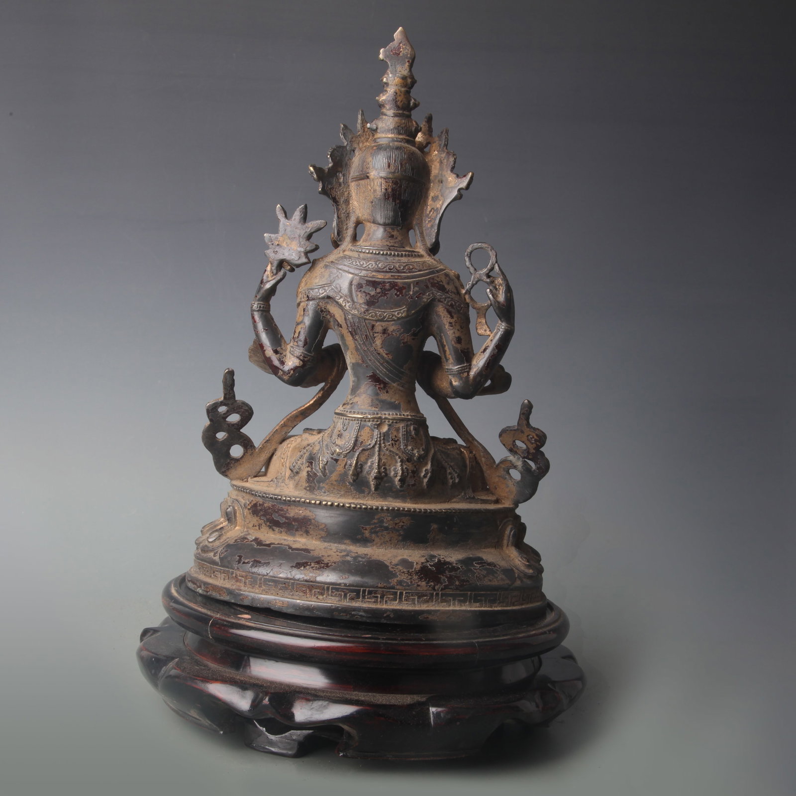 A FOUR-ARMED GUANYIN FIGURE - 4