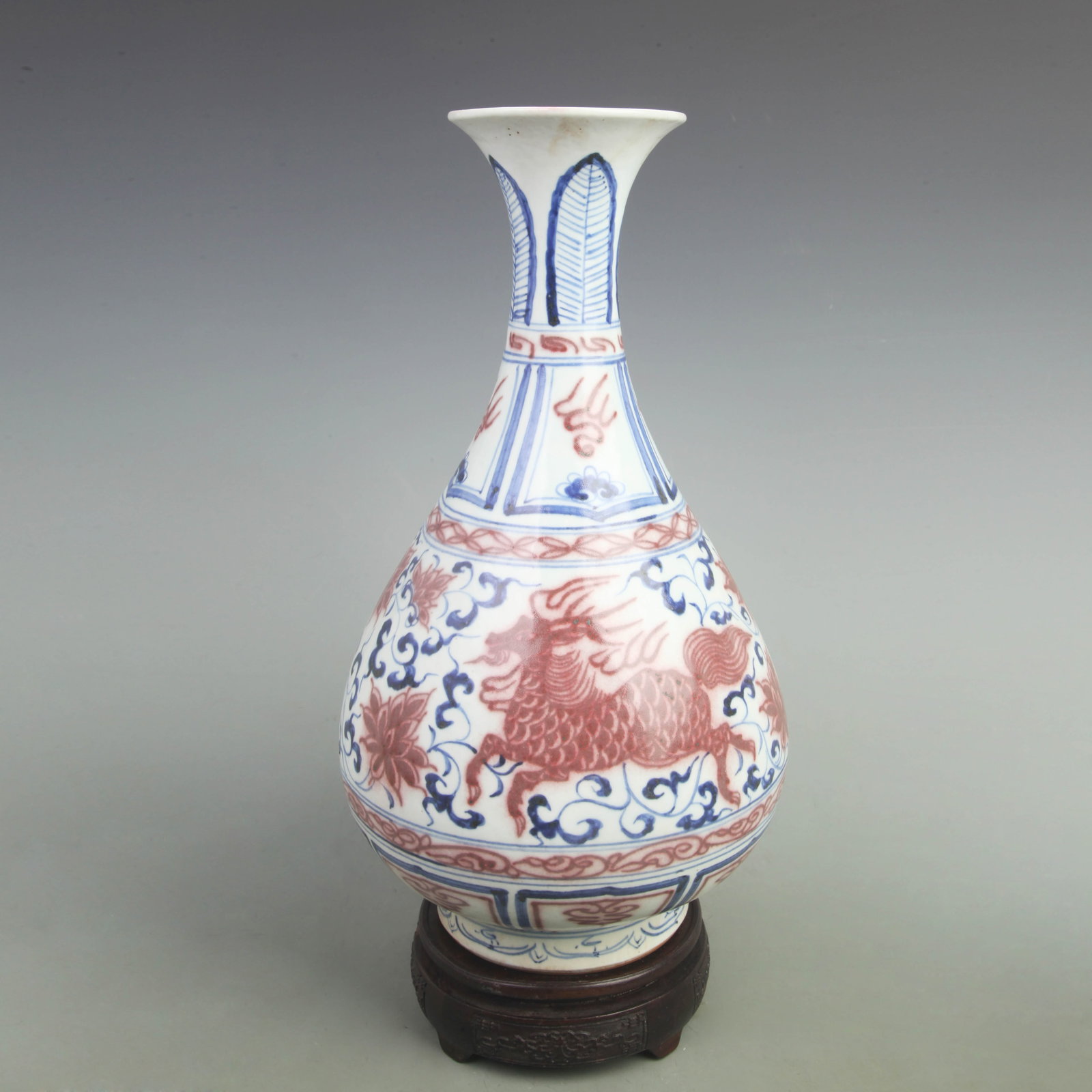 A BLUE AND WHITE AND UNDERGLAZE RED YUHUCHUN VASE WITH BEAST MOTIF: Yuan Dynasty Style; High: 14.8 inch; Width: 8.5 inch; Wooden base for picture and display only.
