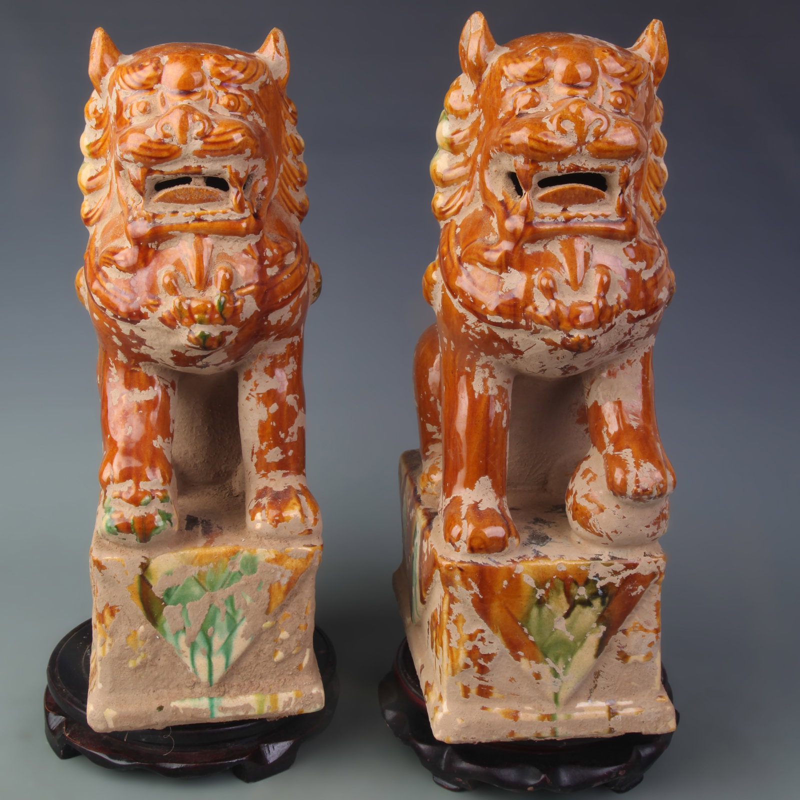 A PAIR OF SANCAI COLOR POTTERY GUARDIAN LIONS FIGURES: Tang Dynasty Style; High: 14.6 inch; Wooden base for picture and display only.
