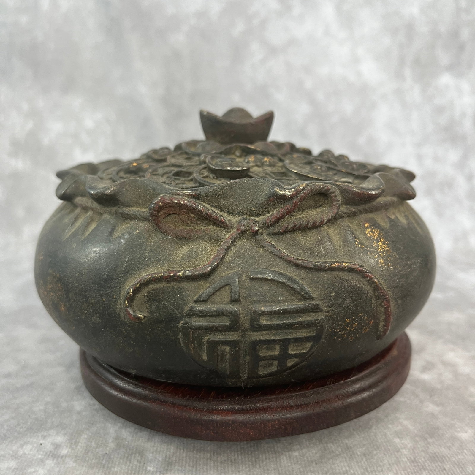 BRONZE "MONEY BAG" INCENSE BURNER: Qing Dynasty; High: 3.2 inch; Diameter: 6.2 inch. Wooden base for picture and display only.