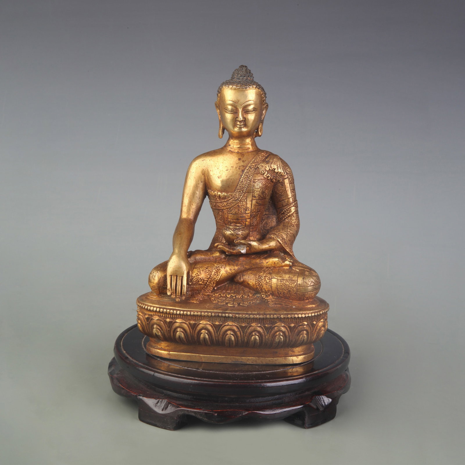 A FINE BRONZE SHAKYAMUNI BUDDHA STATUE: Qing Dynasty; High:7.8 inch; Wooden base for picture and display only.