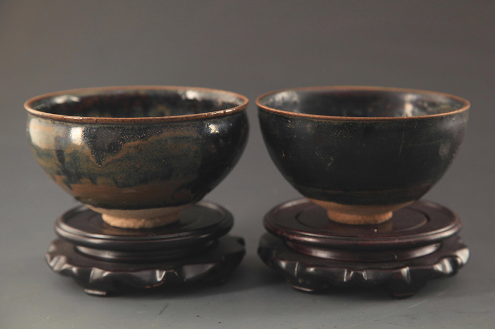 PAIR OF JIAN KILN GLAZED PORCELAIN CUP: Song Dynasty Style; High: 11.75 inch; Diameter: 4.25 inch. Wooden base for picture and display only.