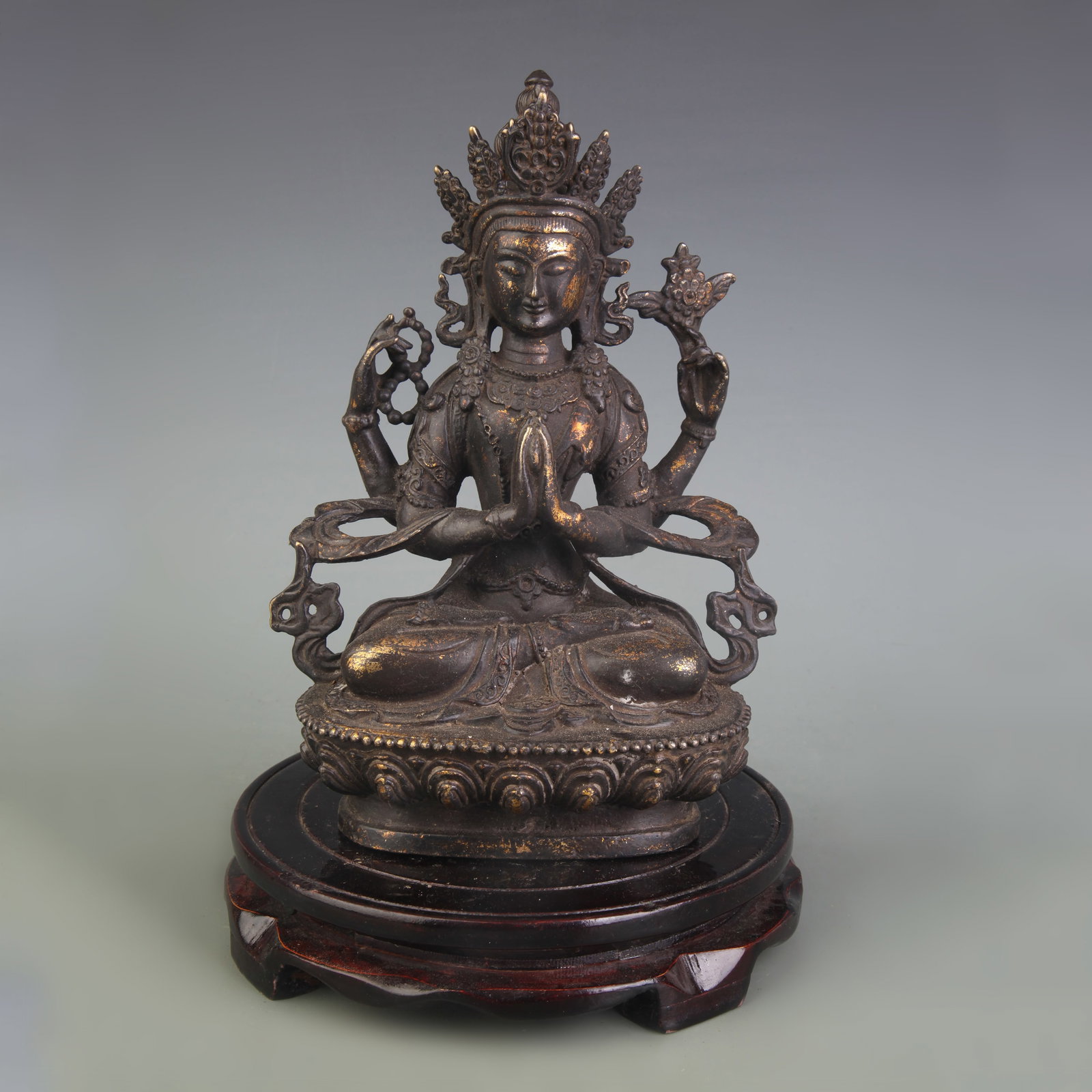 BRONZE FOUR ARMED GUANYIN STATUE: Qing Dynasty; High: 8.6 inch. Wooden base for picture and display only.