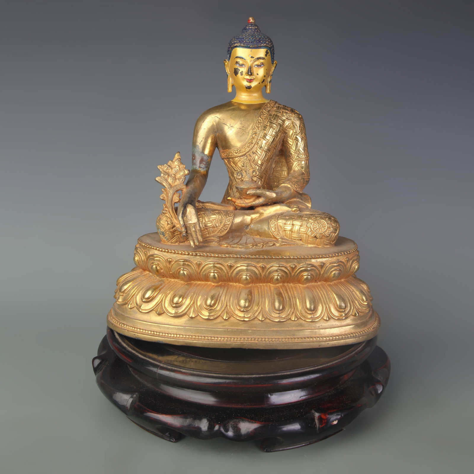 GILDED BRONZE MEDICINE BUDDHA: Qing Dynasty; Width: 8.7 inch; High: 10.0 inch; Wooden base for picture and display only.