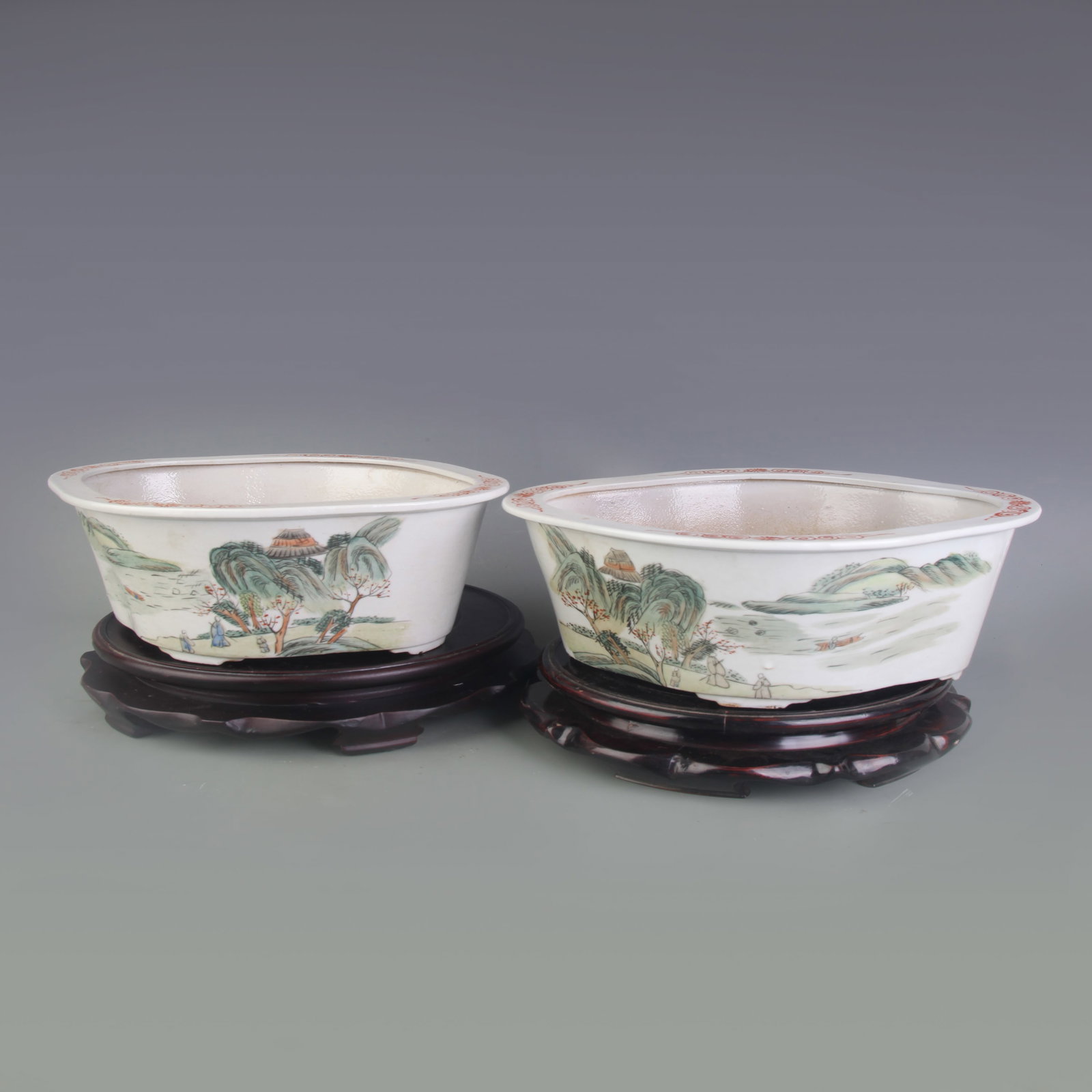 PAIR OF FAMILLE ROSE LANDSCAPE PATTERN FLOWER POTS: Republic Period; Long: 11.3 inch; High:5.0 inch; Wooden base for picture and display only.