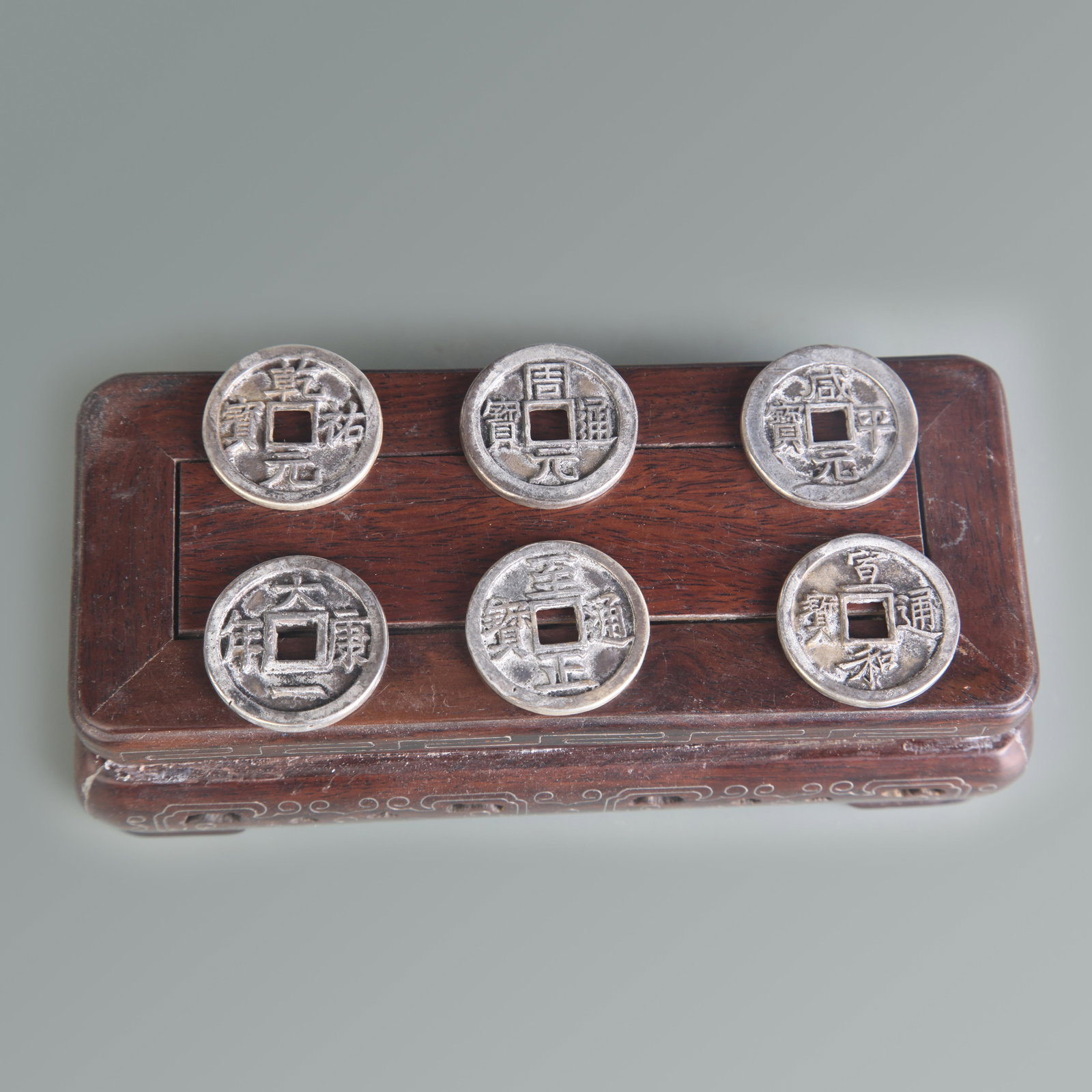 GROUP OF SIX OLD CHINESE LUCKY COINS: Modern, Diameter: 1.2 inch; Wooden base for picture and display only.