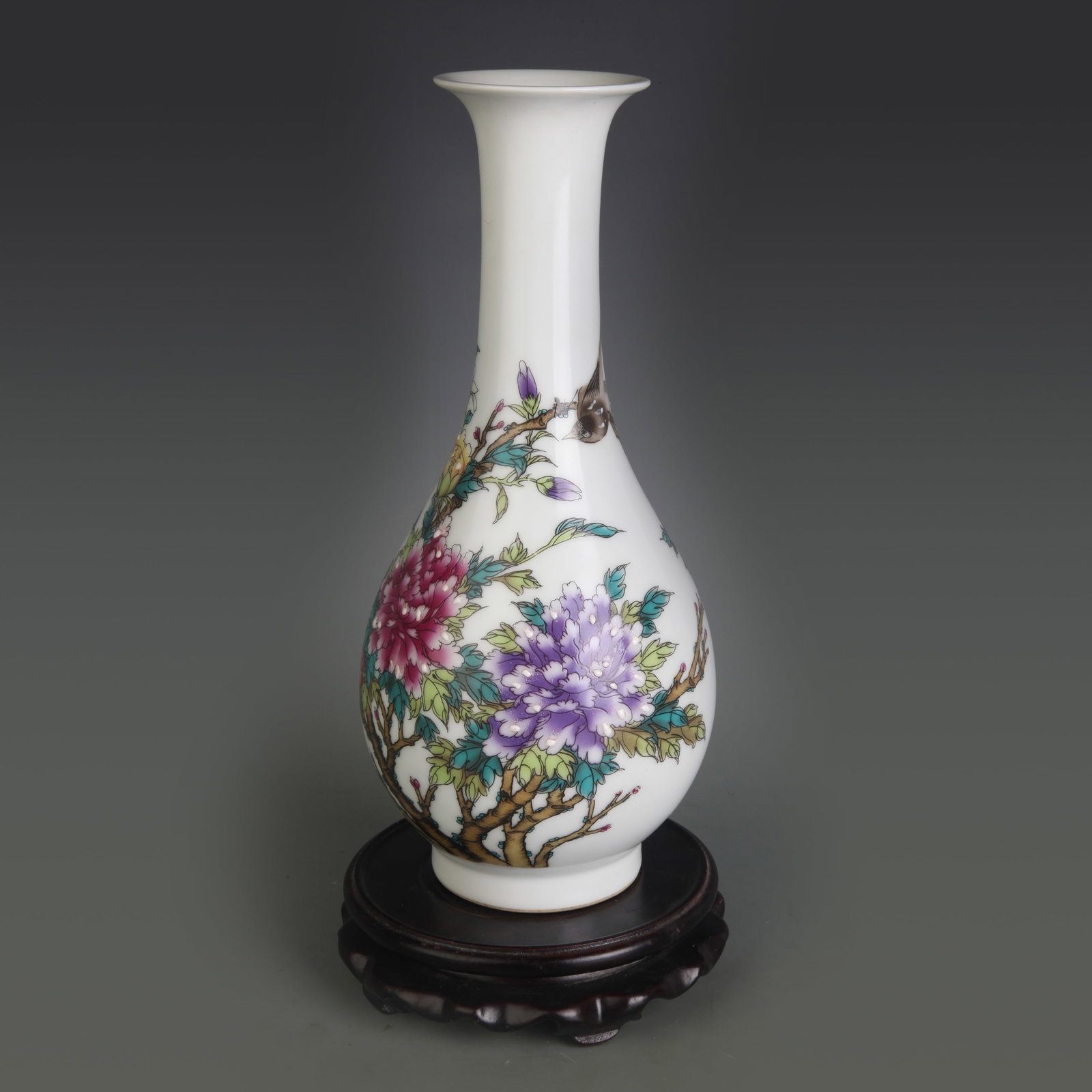 A FAMILLE ROSE LONG-NECK VASE WITH BIRD-AND-FLOWER MOTIF: Qing Dynasty; Diameter: 2.5 inch; High: 10.3 inch; Wooden base for picture and display only.