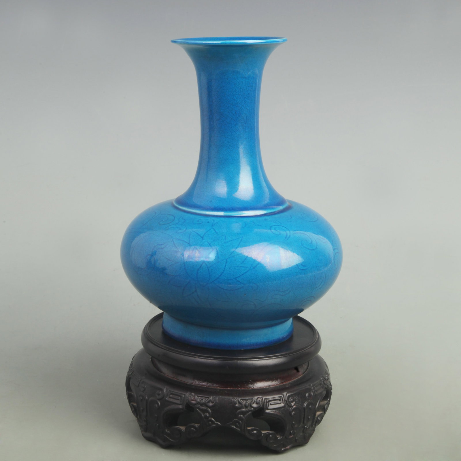 DARK BLUE COLOR GLAZED PORCELAIN BOTTLE: Ming Dynasty Hong Zhi Style, High: 8.5 inch; Width: 6.5 inch. Wooden base for picture and display only.