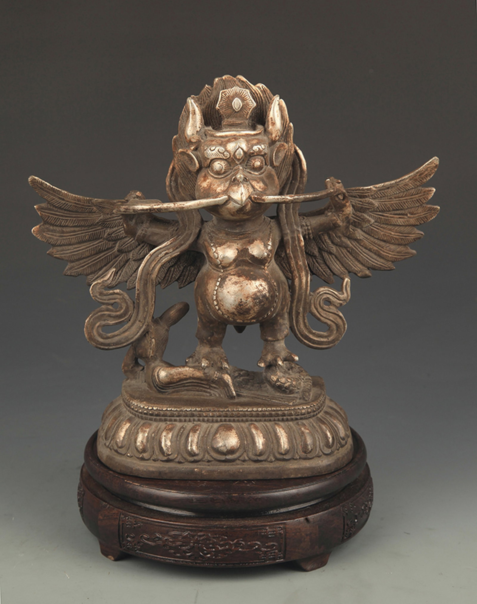 A TIBETAN BUDDHISM BRONZE GARU?A STATUE: 19th Century, High: 8.25 inch; Width: 9.0 inch. Wooden base for picture and display only.