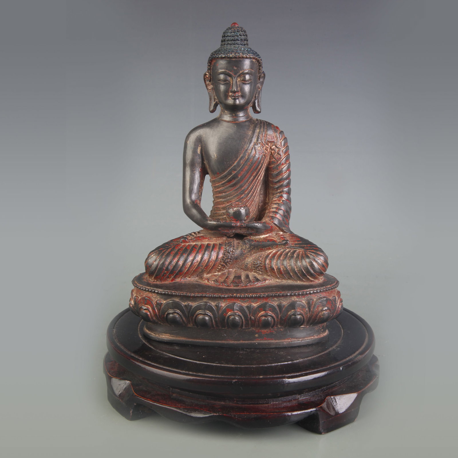 A BRONZE FIGURE OF MEDICINE BUDDHA: Qing Dynasty; Width: 5.0 inch; High: 7.5 inch; Wooden base for picture and display only.