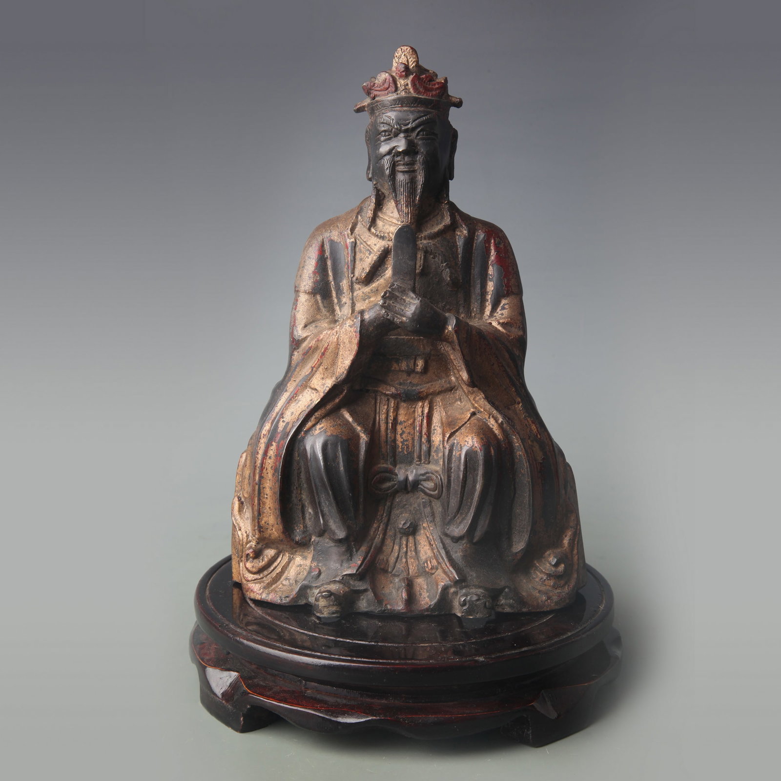 GILT AND BRONZE FIGURE OF SEATED WENGUAN (CIVIL OFFICIAL): Qing Dynasty; Width: 5.6 inch; High: 8.5 inch; Wooden base for picture and display only.