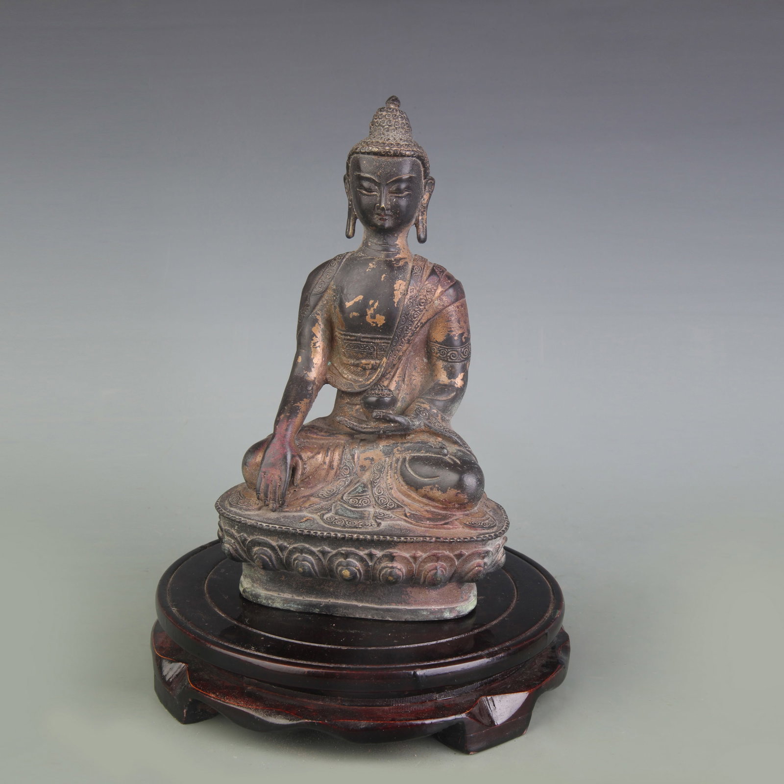A FINE BRONZE SHAKYAMUNI BUDDHA STATUE: Qing Dynasty; High: 8.0 inch; Wooden base for picture and display only.