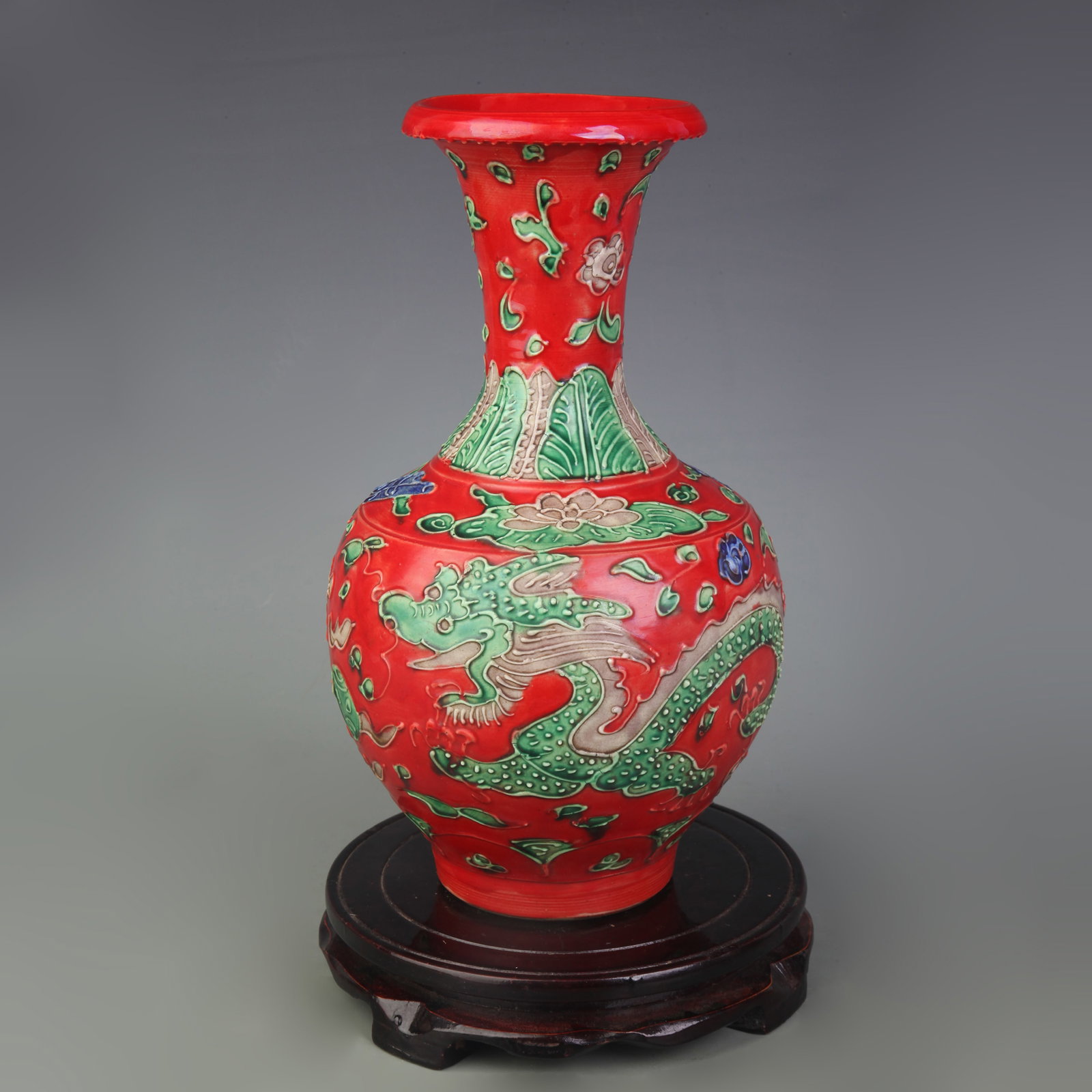 FAHUA GLAZED CARVED DRAGON VASE: Ming Dynasty Style Hong Zhi Period; High: 10.6 inch. Wooden base for picture and display only.