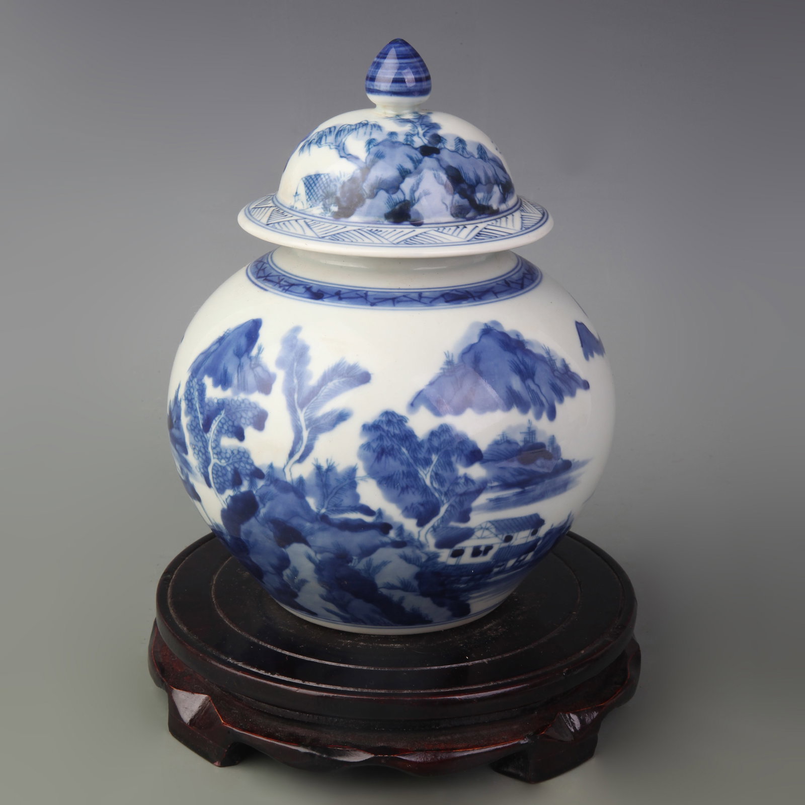 BLUE AND WHITE LANDSCAPE LIDDED PORCELAIN JAR: Qing Dynasty Kang Xi Period; Diameter: 2.7 inch; High: 7.6 inch; Wooden base for picture and display only.