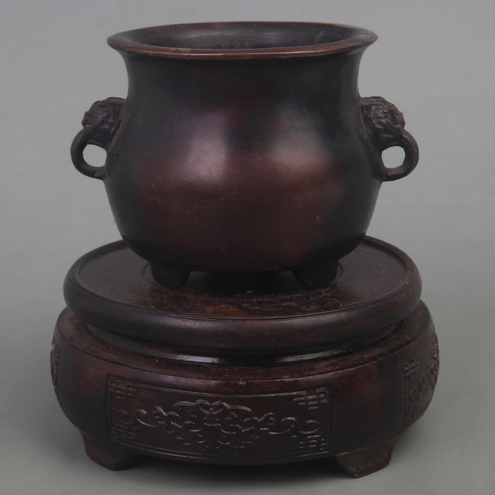 A FINE XUAN DE STYLE LION EAR THREE FOOT BRONZE CENSER: Ming Dynasty Style; Diameter: 3.8 inch; High: 2.8 inch. Wooden base for picture and display only.