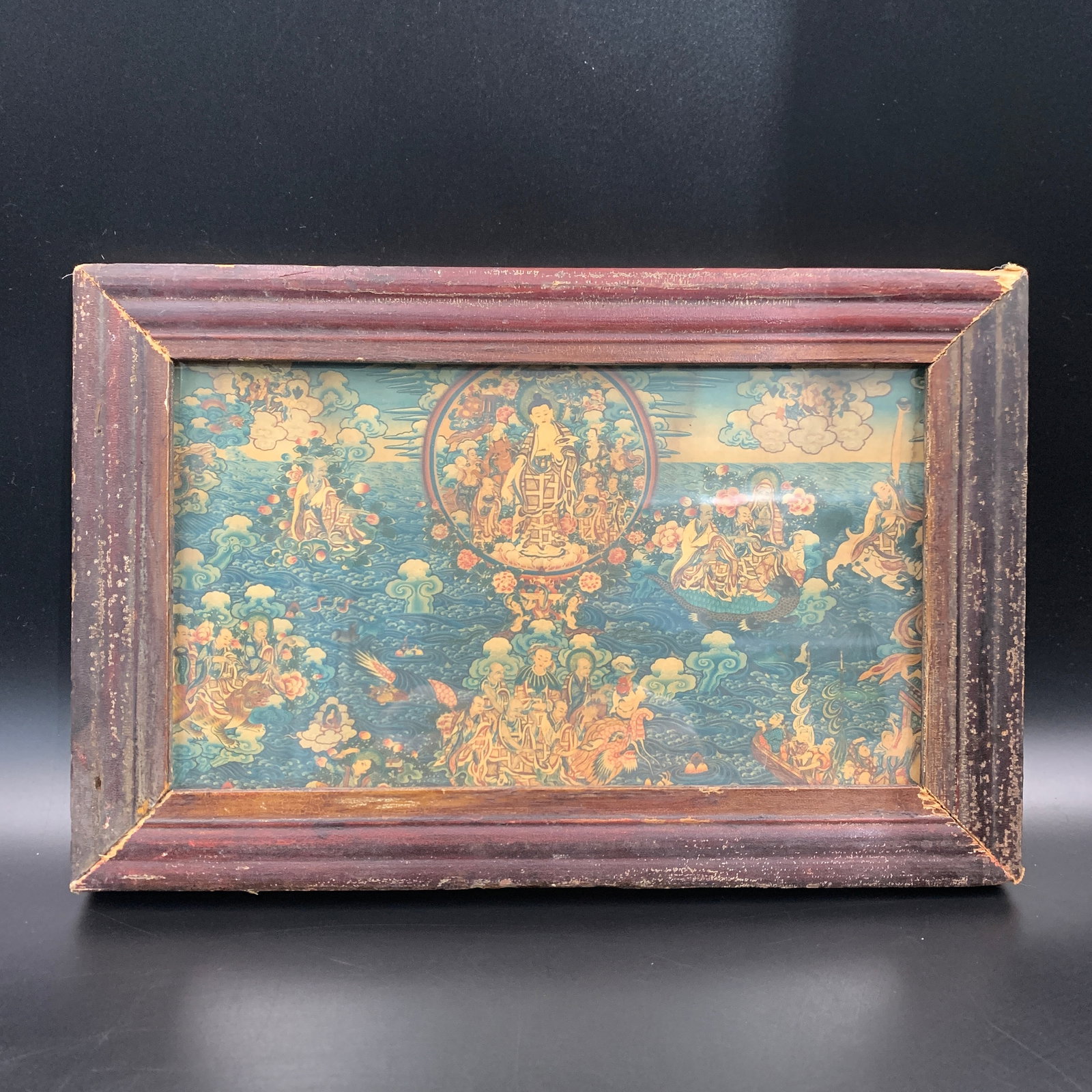 A SMALL VINTAGE TIBETAN BUDDHIST THANGKA IN WOODEN FRAME: Republic Period; Long: 11.3 inch; Width: 7.3 inch; High: 0.8 inch. Wooden base for picture and display only.