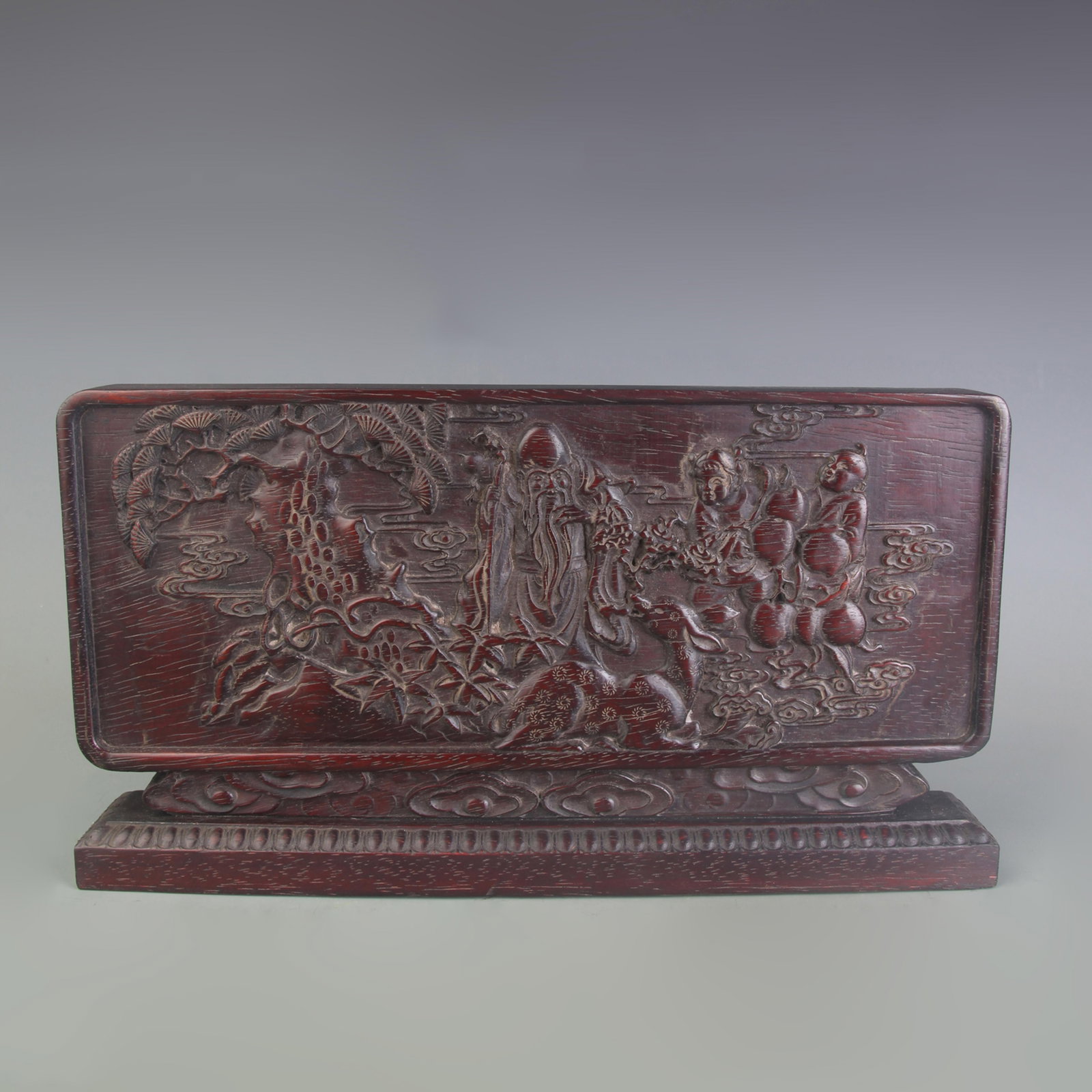 A SMALL ZITAN WOOD CARVED TABLE SCREEN INSCRIBED “HARMONY BRINGS PROSPERITY: Qing Dynasty; Long: 4.0 inch; High: 7.5 inch; Wooden base for picture and display only.