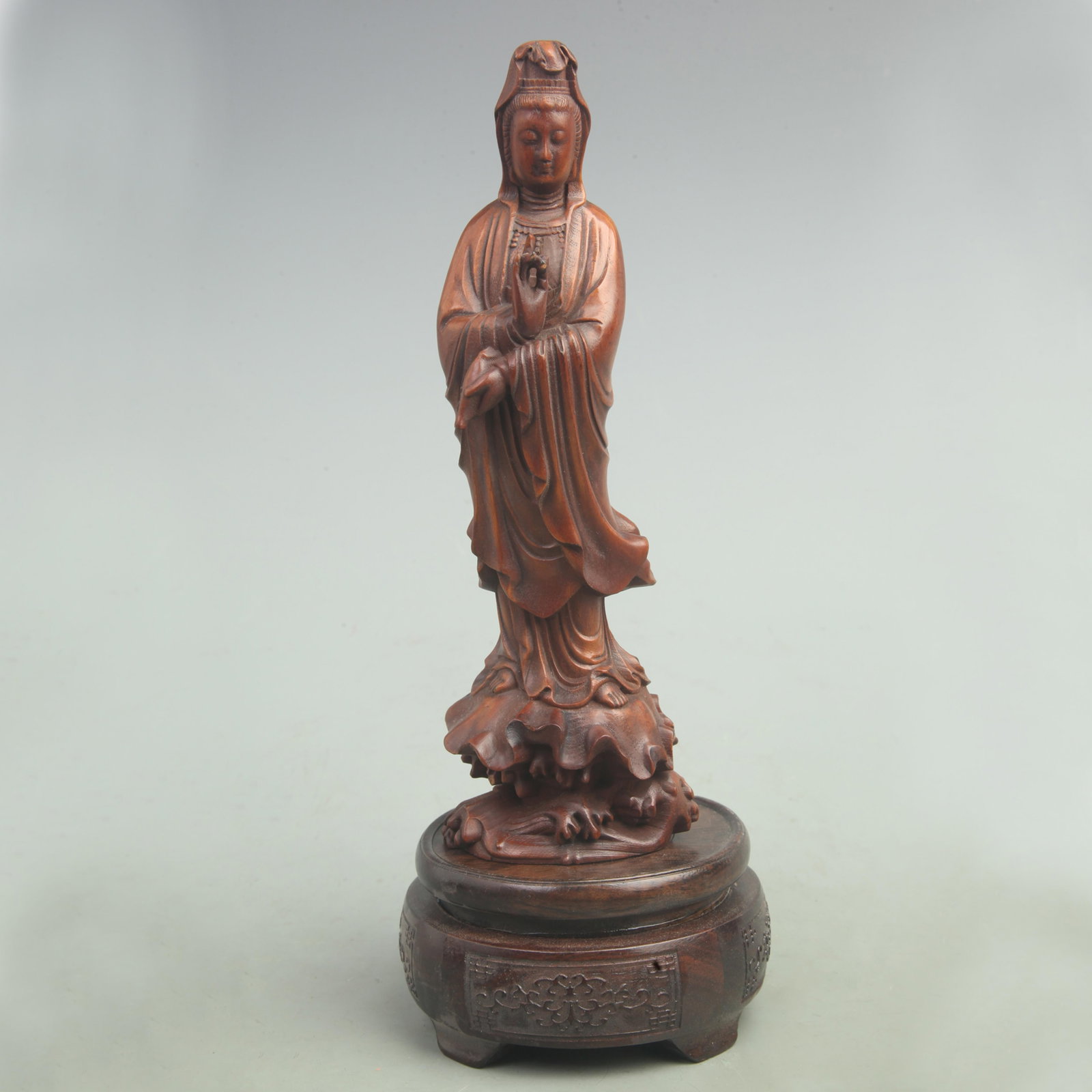 A FINE BOXWOOD IN FIGURE OF GUAN YIN BUDDHA: Qing Dynasty; High: 8 inch; Width: 2.6 inch. Wooden base for picture and display only.