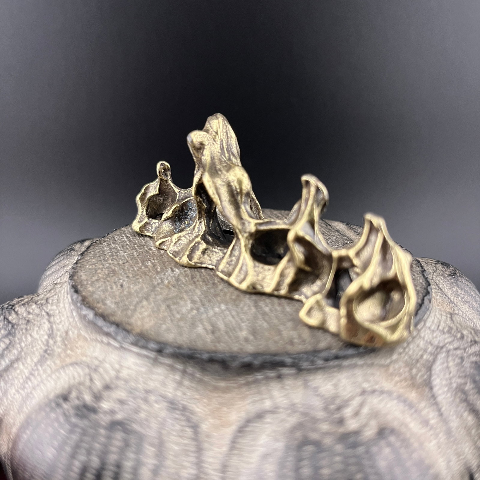 A SMALL BRONZE MOUNTAIN FIGURE - 3