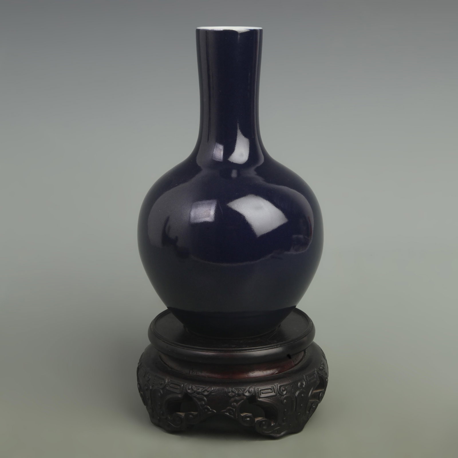 A DARK BLUE GLAZED CELESTIAL GLOBE PORCELAIN VASE: Qing Dynasty Qianlong Period; High: 8.5 inch; Width: 5.5 inch. Wooden base for picture and display only.