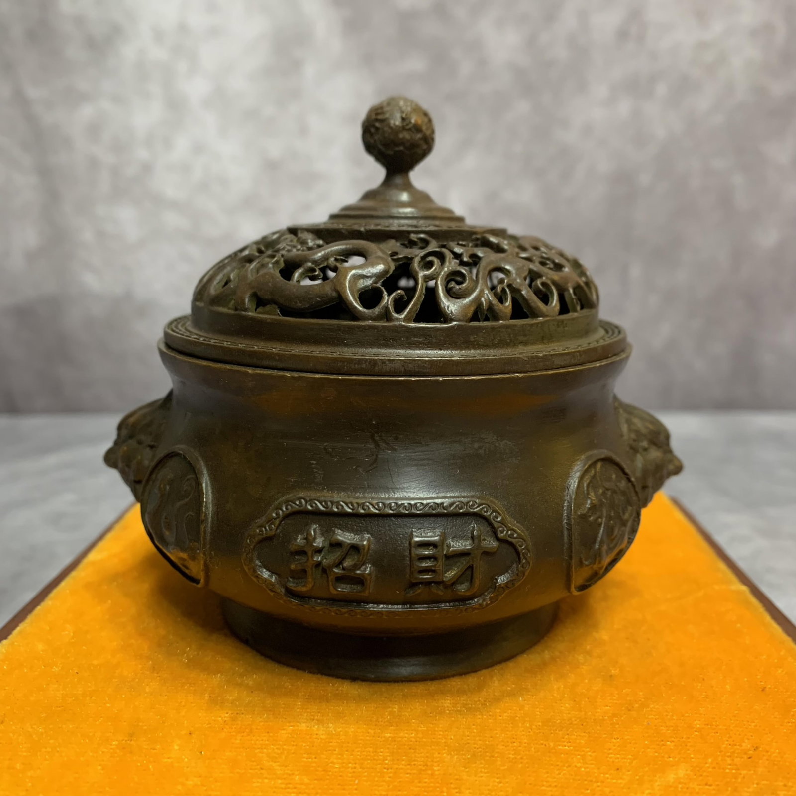 A FINELY CARVED ROUND BRONZE CENSER: 20th Century; High: 3.8 inch; Diameter: 3.7 inch; Wooden base for picture and display only.