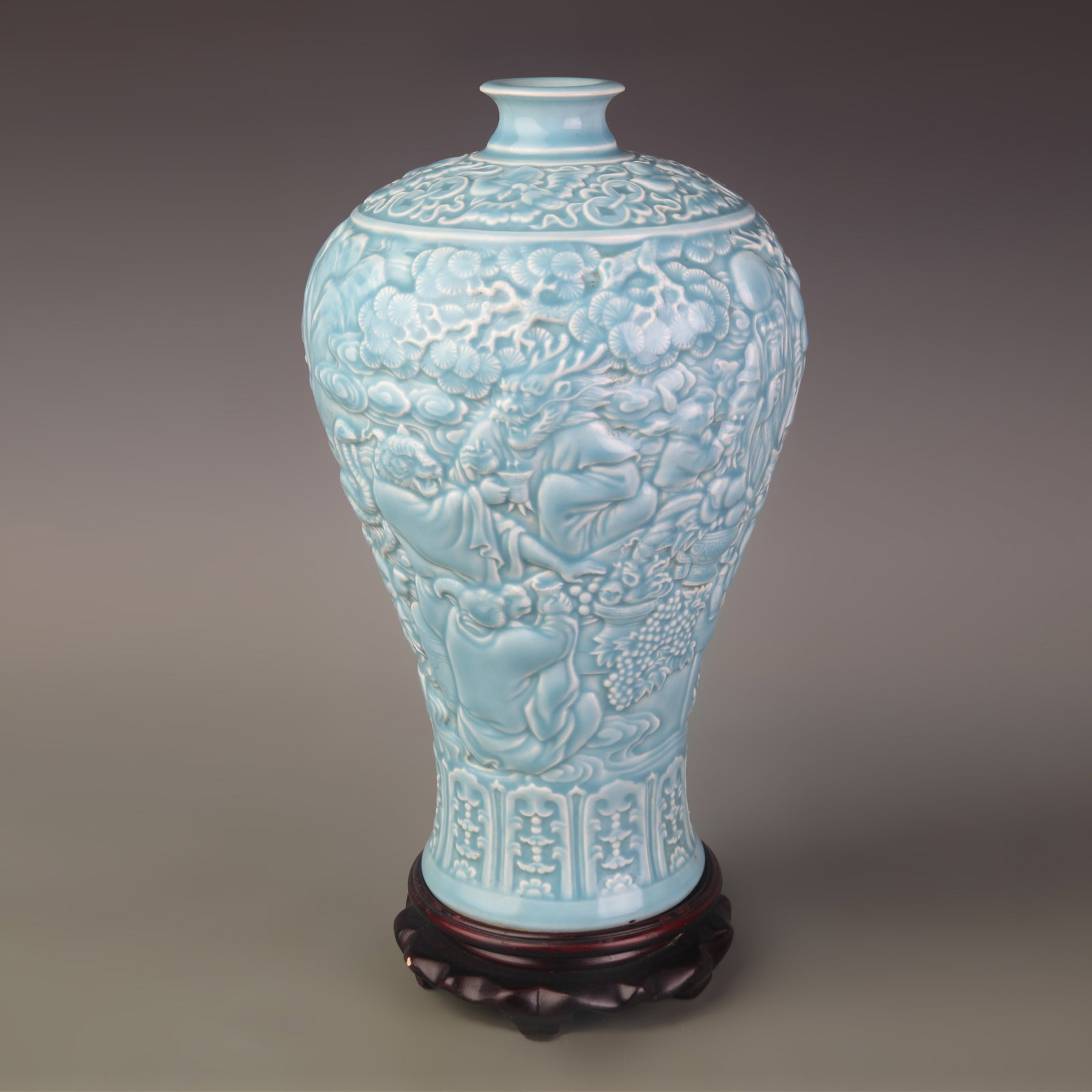 A SKY-BLUE GLAZED CARVED MEIPING PORCELAIN VASE: Qing Dynasty Qian Long Period; Diameter: 4.2 inch; High: 11.6 inch; Wooden base for picture and display only.