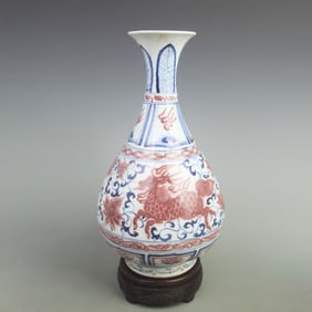 A BLUE AND WHITE AND UNDERGLAZE RED YUHUCHUN VASE WITH BEAST MOTIF