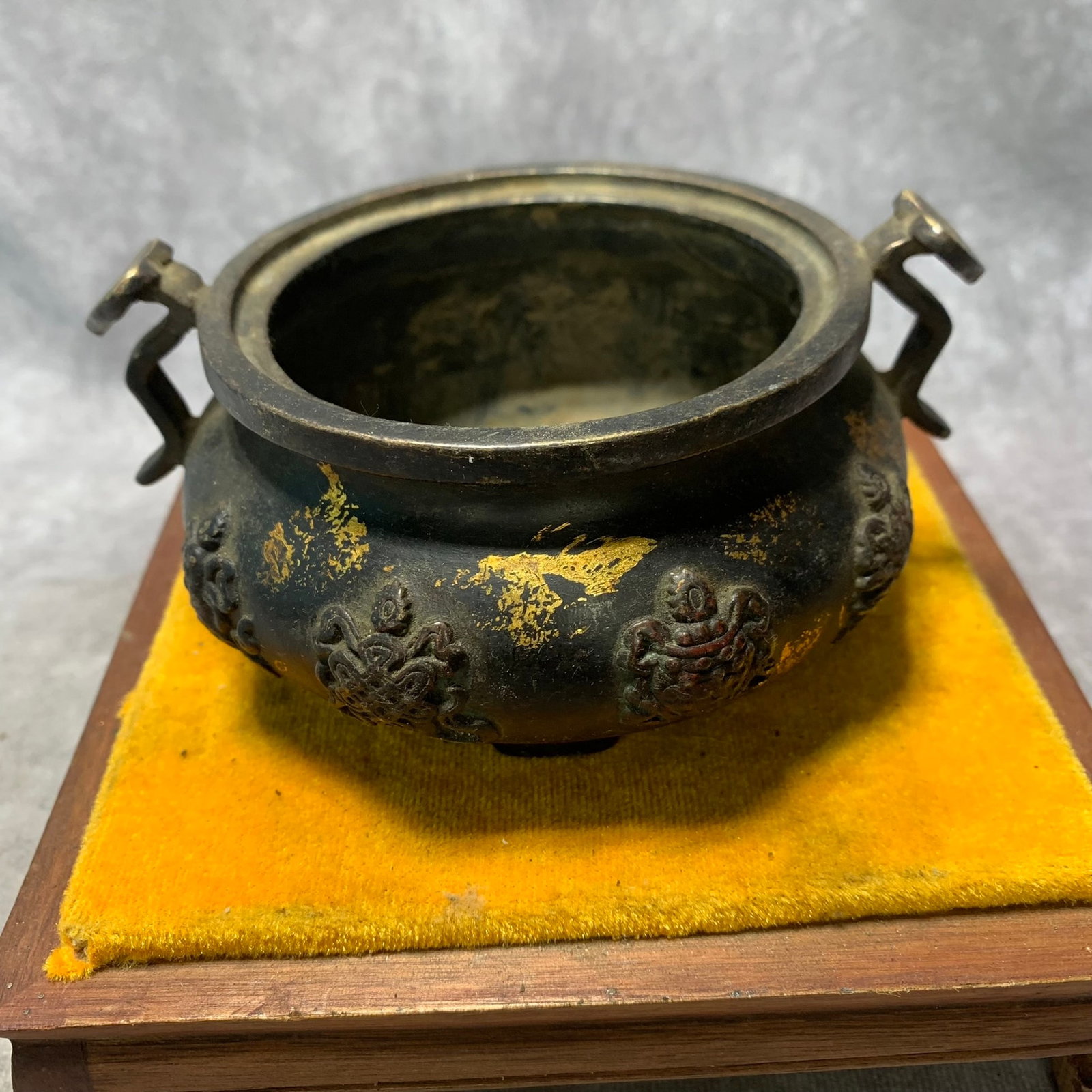 REPUBLIC OF CHINA BRONZE GILDED EIGHT-TREASURE DESIGN RUYI-EAR INCENSE BURNER: Republic Period; High: 2.4 inch; Diameter: 4.5 inch; Woodbase for picture and display only