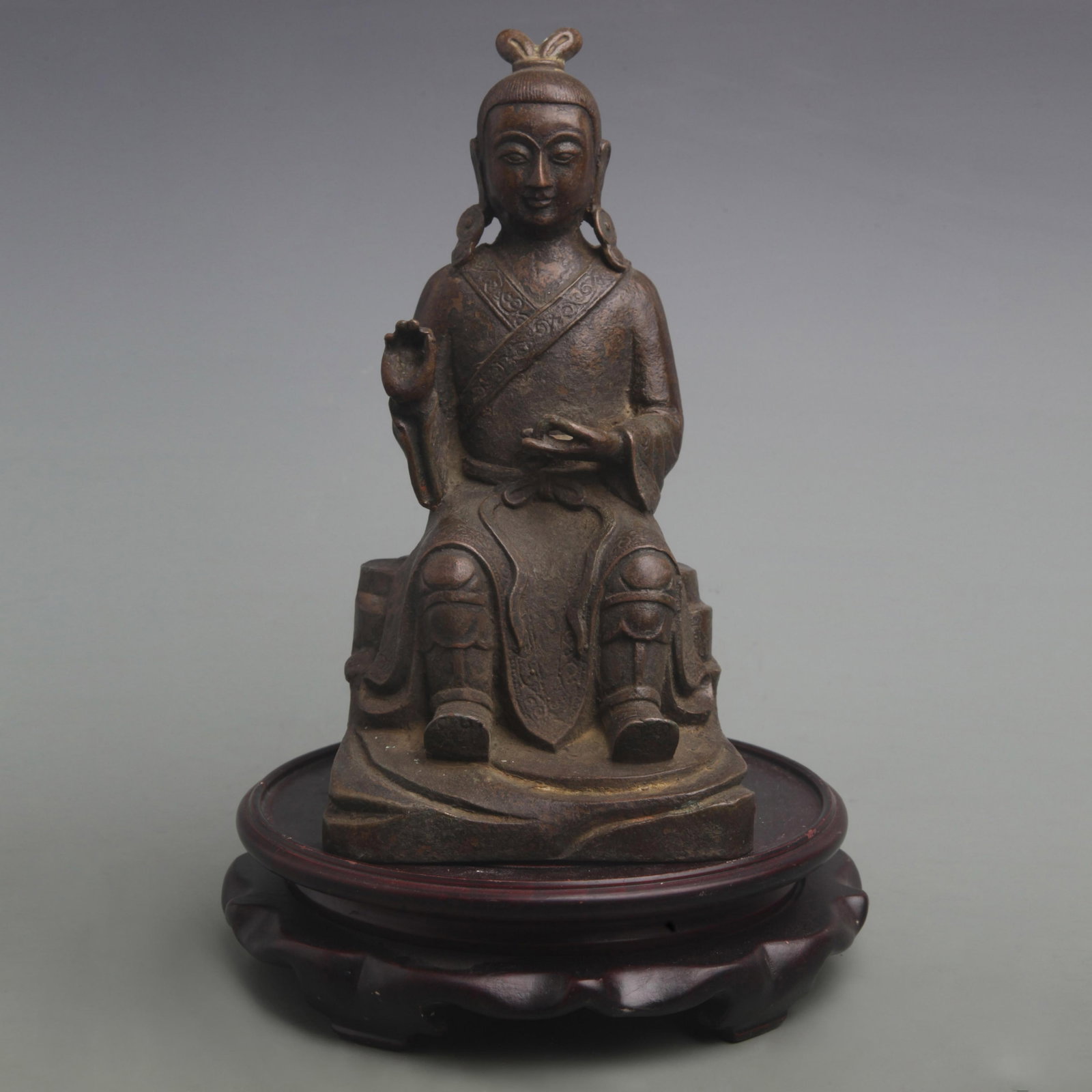 BRONZE SEATED DAOIST IMMORTAL: Qing Dynasty; High: 10.1 inch; Width: 9.8 inch; Woodbase for picture and display only