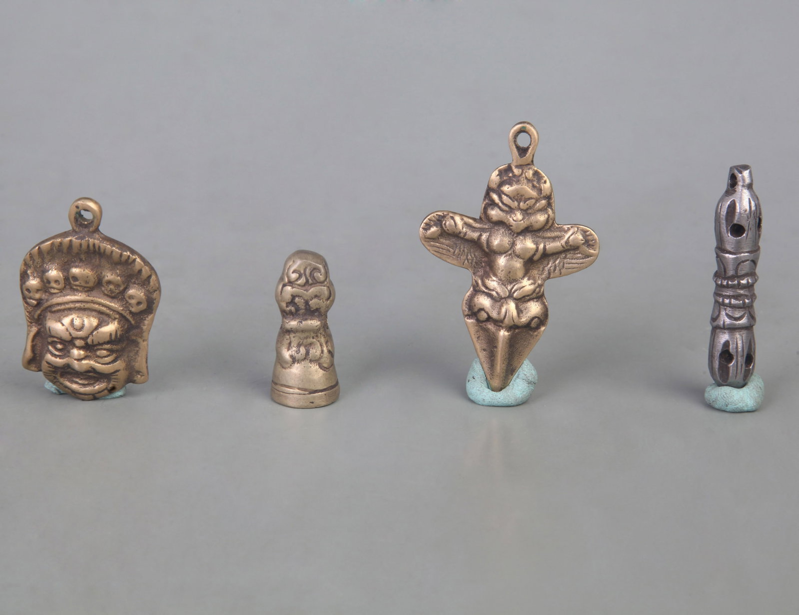 GROUP TIBETAN BUDDHISM BRONZE PENDANT: Qing Dynasty; Long: 2.2 inch; to 1.2 inch; Woodbase for picture and display only