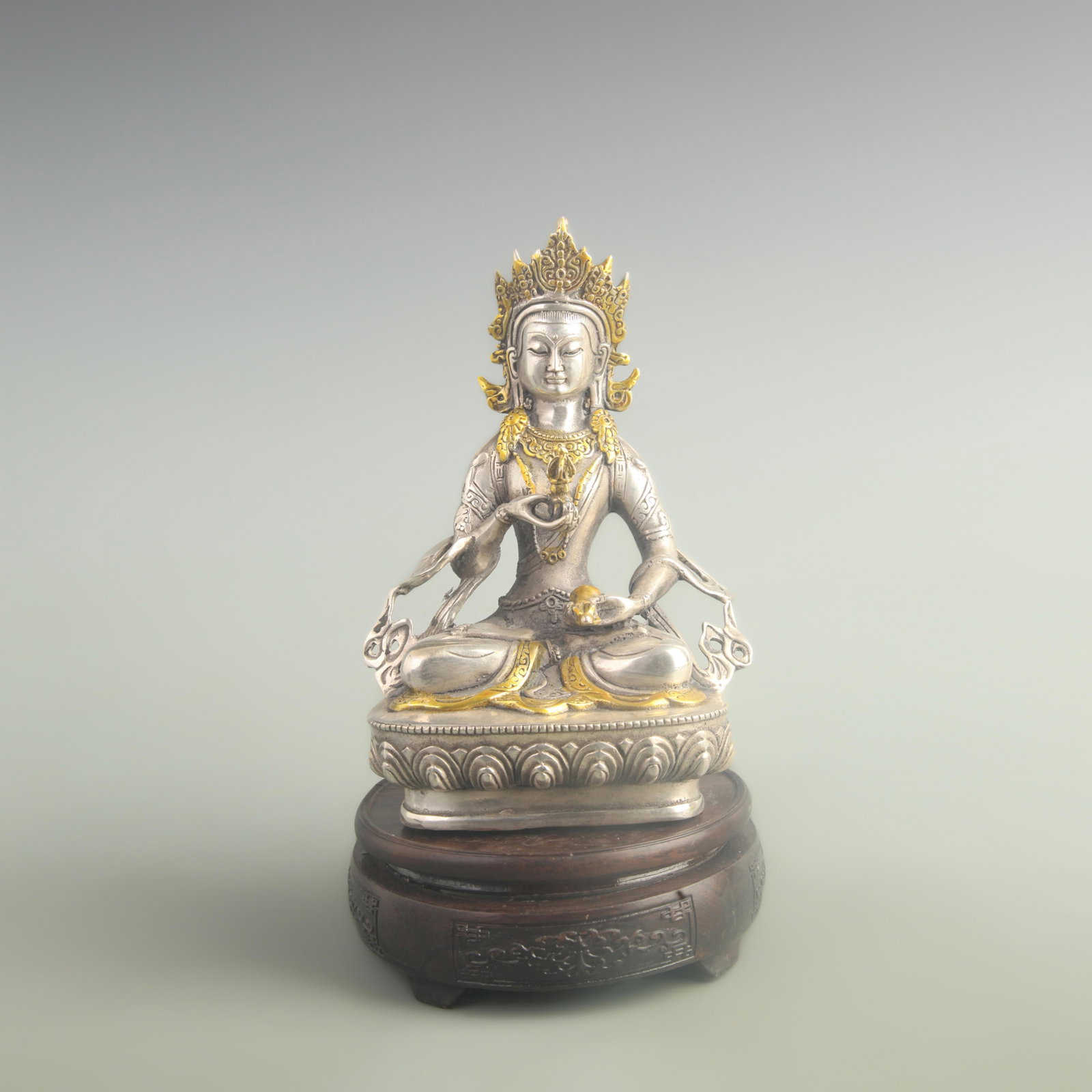 A FINE GILT-BRONZE FIGURE OF VAJRASATTVA: 20th Century; High: 7.90 inch; Width: 2.30 inch; Long: 3.80 inch; Woodbase for picture and display only