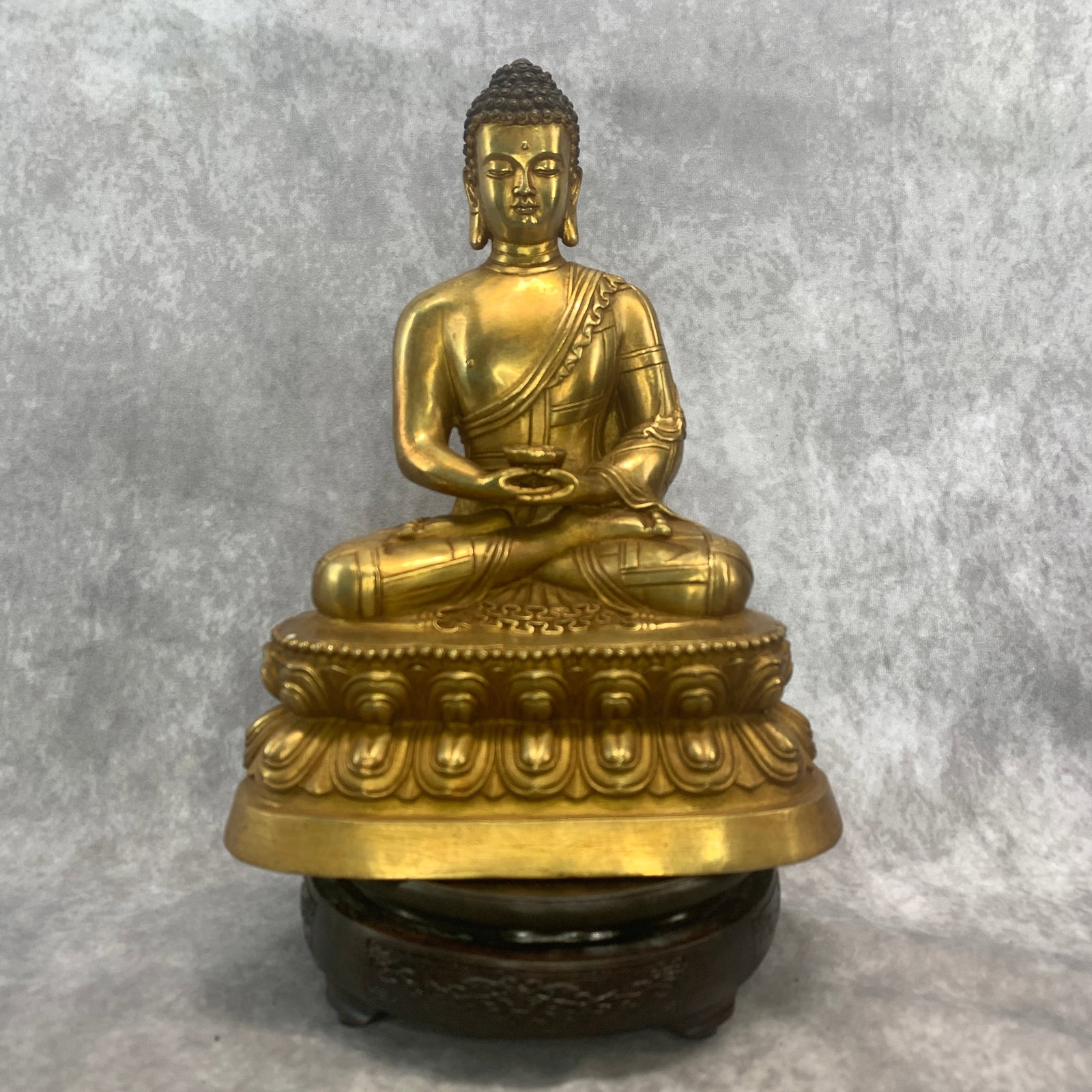 A FINE TIBETAN GILT-BRONZE FIGURE OF AMITABHA BUDDHA: Qing Dynasty; Long: 8.2 inch; Width: 5 inch; High: 10.5 inch; Woodbase for picture and display only