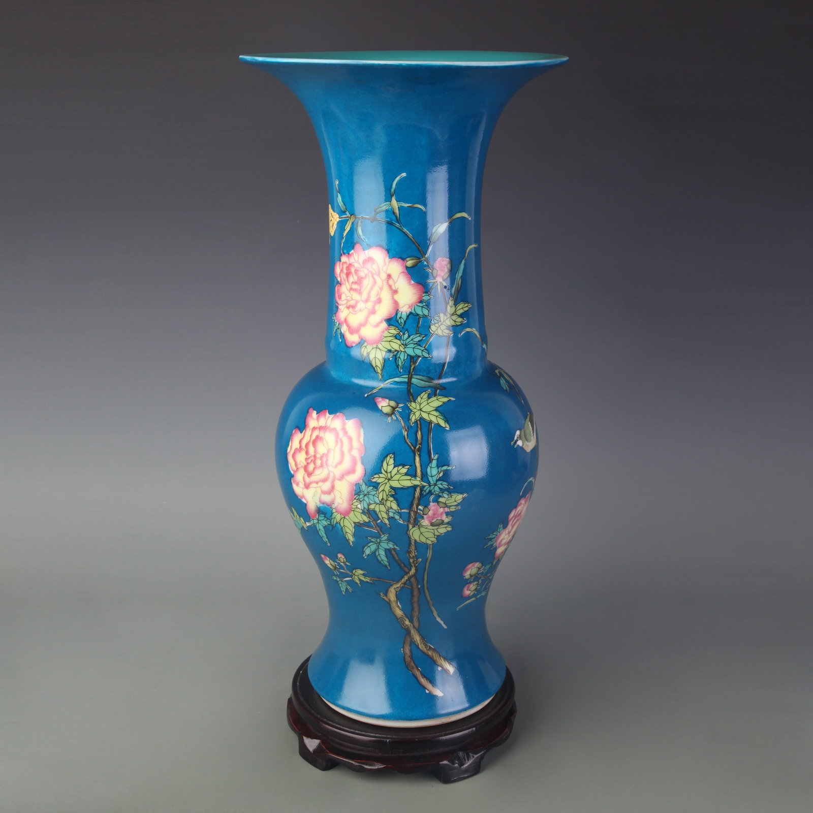 FAMILLE ROSE PEACOCK-BLUE GROUND GU VASE WITH BIRD-AND-FLOWER DECORATION: Qing Dynasty Yong Zheng Period; High: 18.4inch; Woodbase for picture and display only