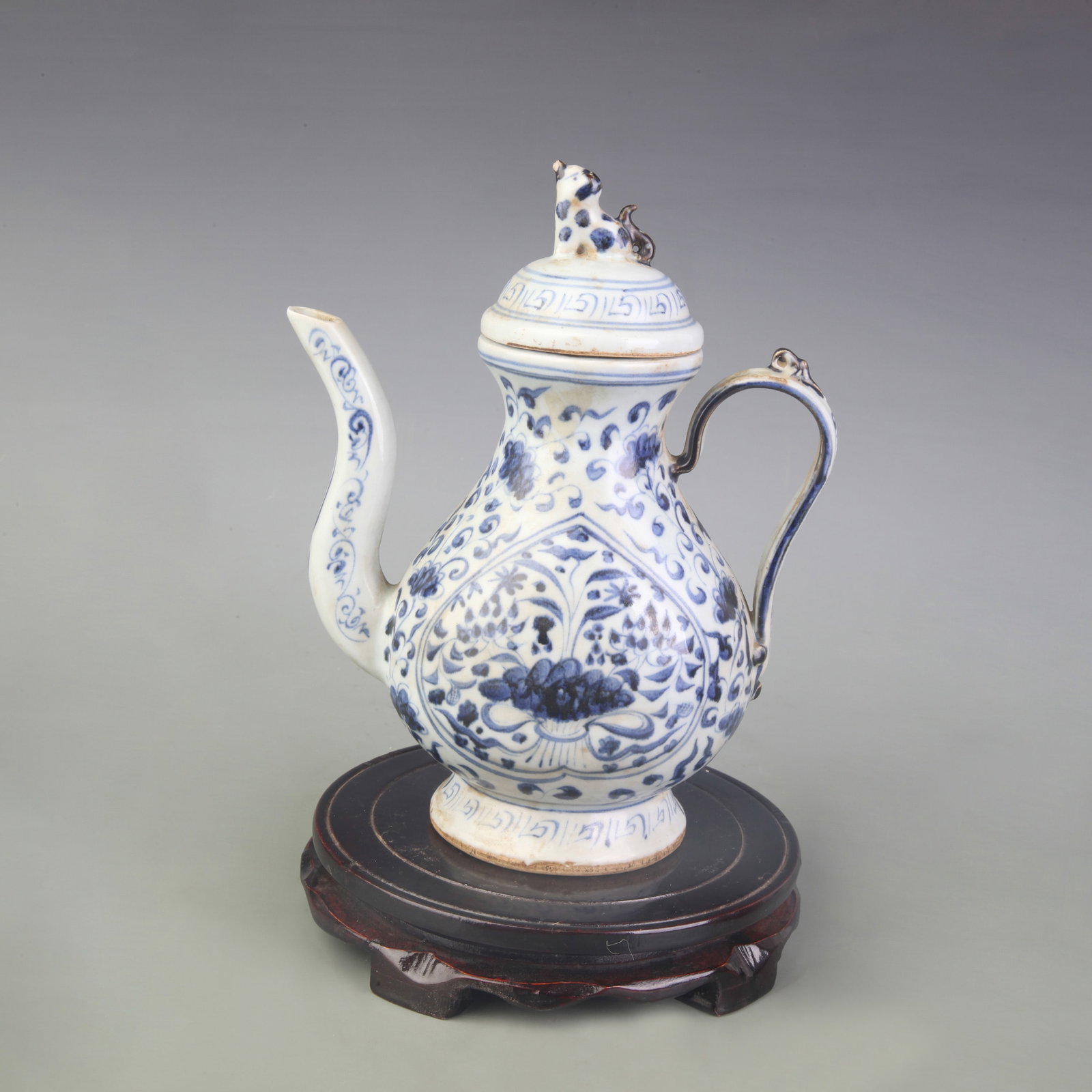 BLUE AND WHITE FLOWERED TEA POT WITH FLOWER DESIGN: Ming Dynasty Style; Width: 7.3 inch; High: 9.0 inch; Woodbase for picture and display only