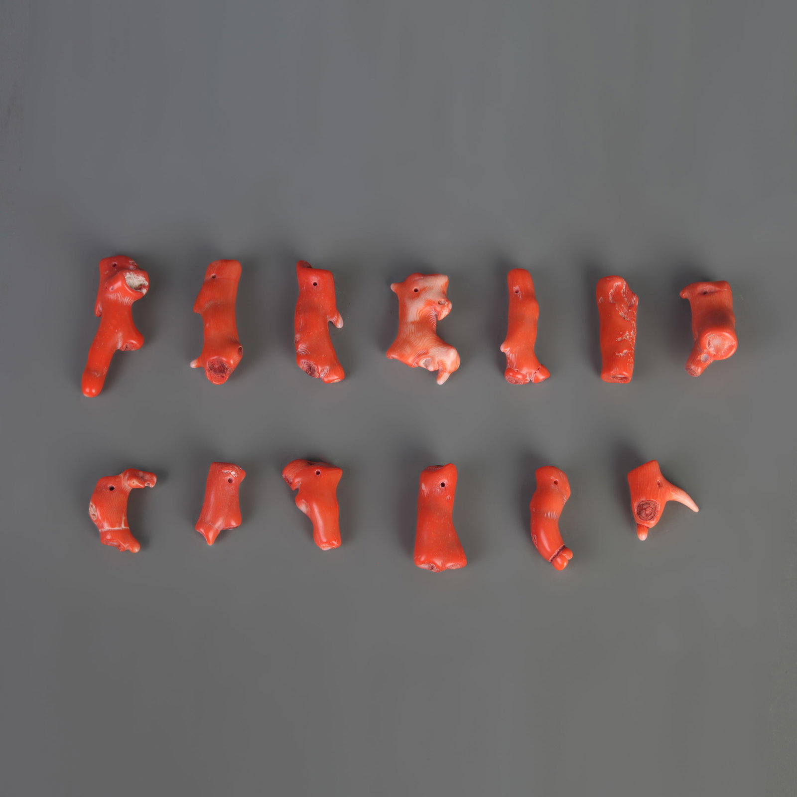 A GROUP OF CORAL PENDANTS: Modern; Long: 1.0 inch; to 2.5 inch; Woodbase for picture and display only
