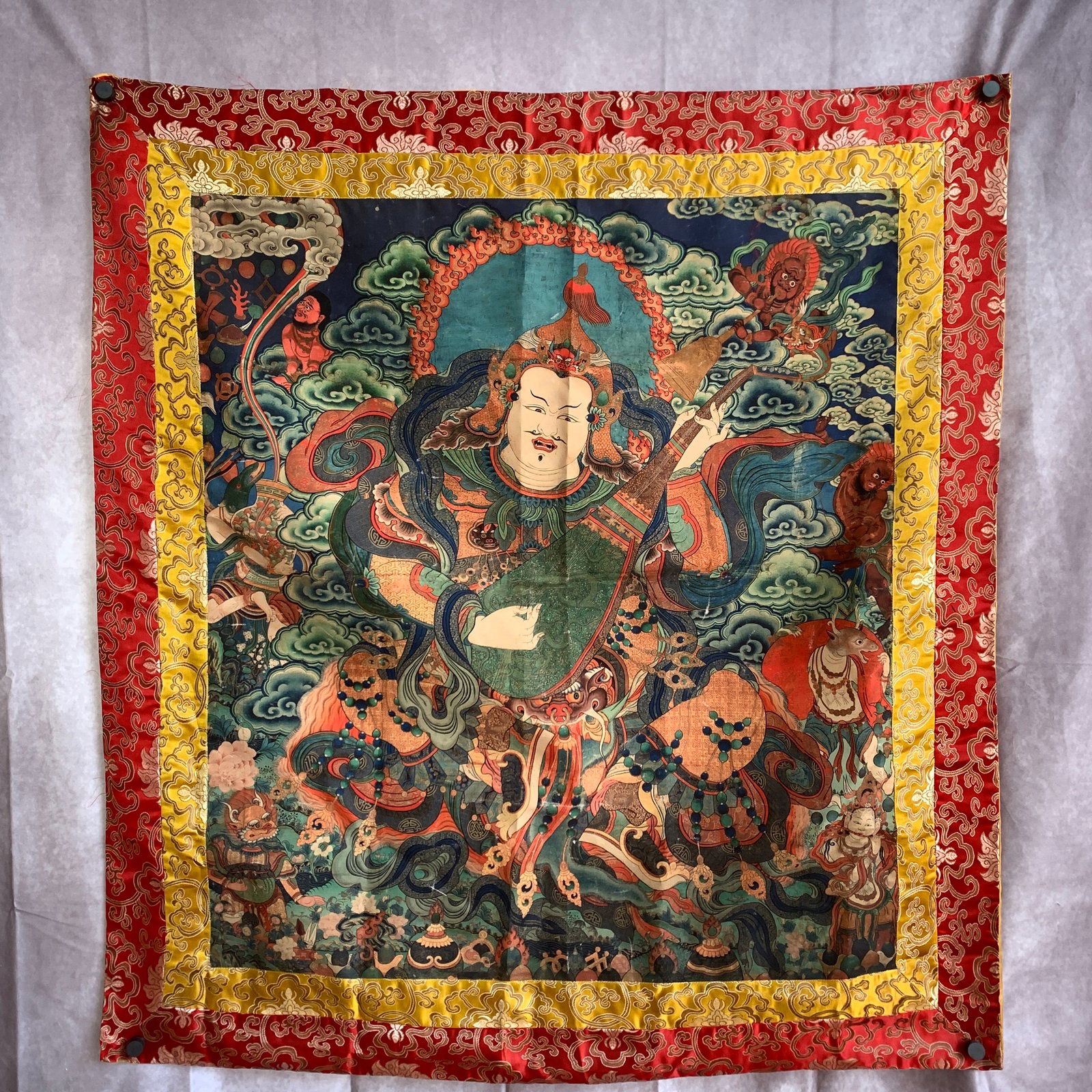 A FINE TIBETAN BUDDHIST THANGKA IN FIGURE OF VAISHRAVANA (KUBERA): Qing Dynasty; Long: 43 inch; Width: 40 inch; Woodbase for picture and display only