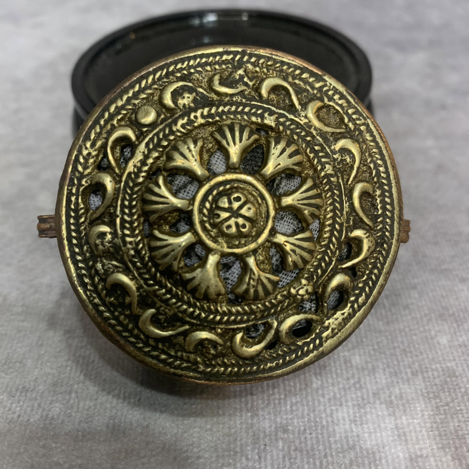 TIBETAN OPENWORK BRASS RITUAL BOX LID: Qing Dynasty; High: 1.0 inch; Diameter: 2.3 inch; Woodbase for picture and display only