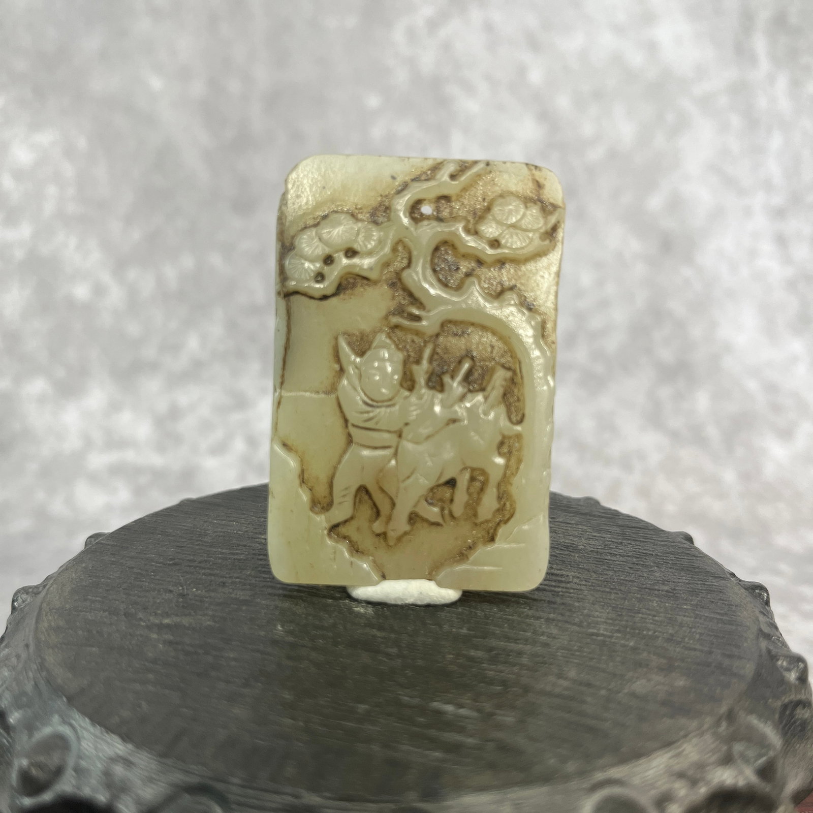 A FINE HETIAN WHITE JADE PENDANT WITH PLUM TREE FIGURE: Qing Dynasty; Long: 2.14 inch; Width: 1.42 inch; High: 0.29 inch; Woodbase for picture and display only