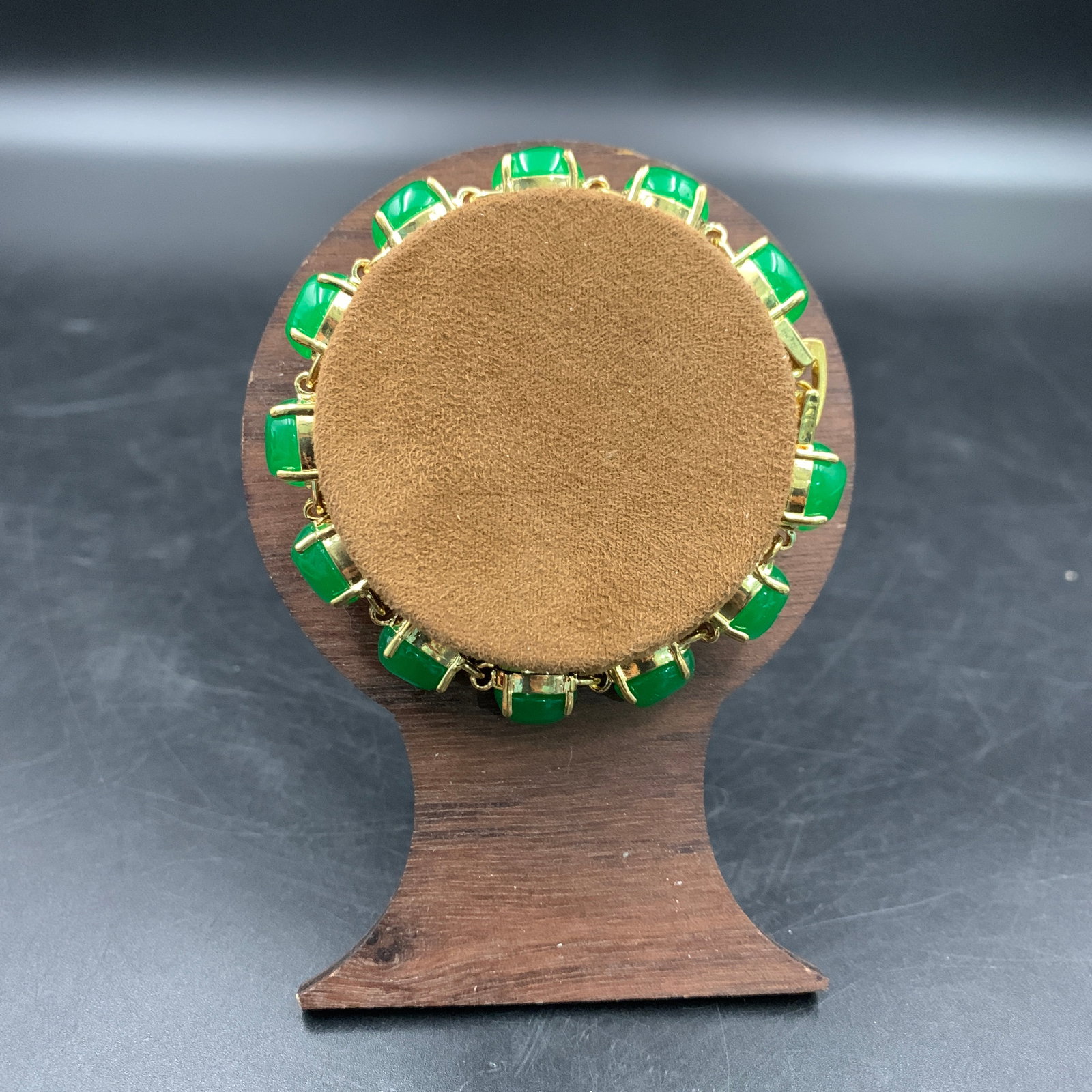 IMPERIAL GREEN JADEITE BRACELET: Modern; Long: 2.9 inch; Diameter: 0.3 inch; Woodbase for picture and display only