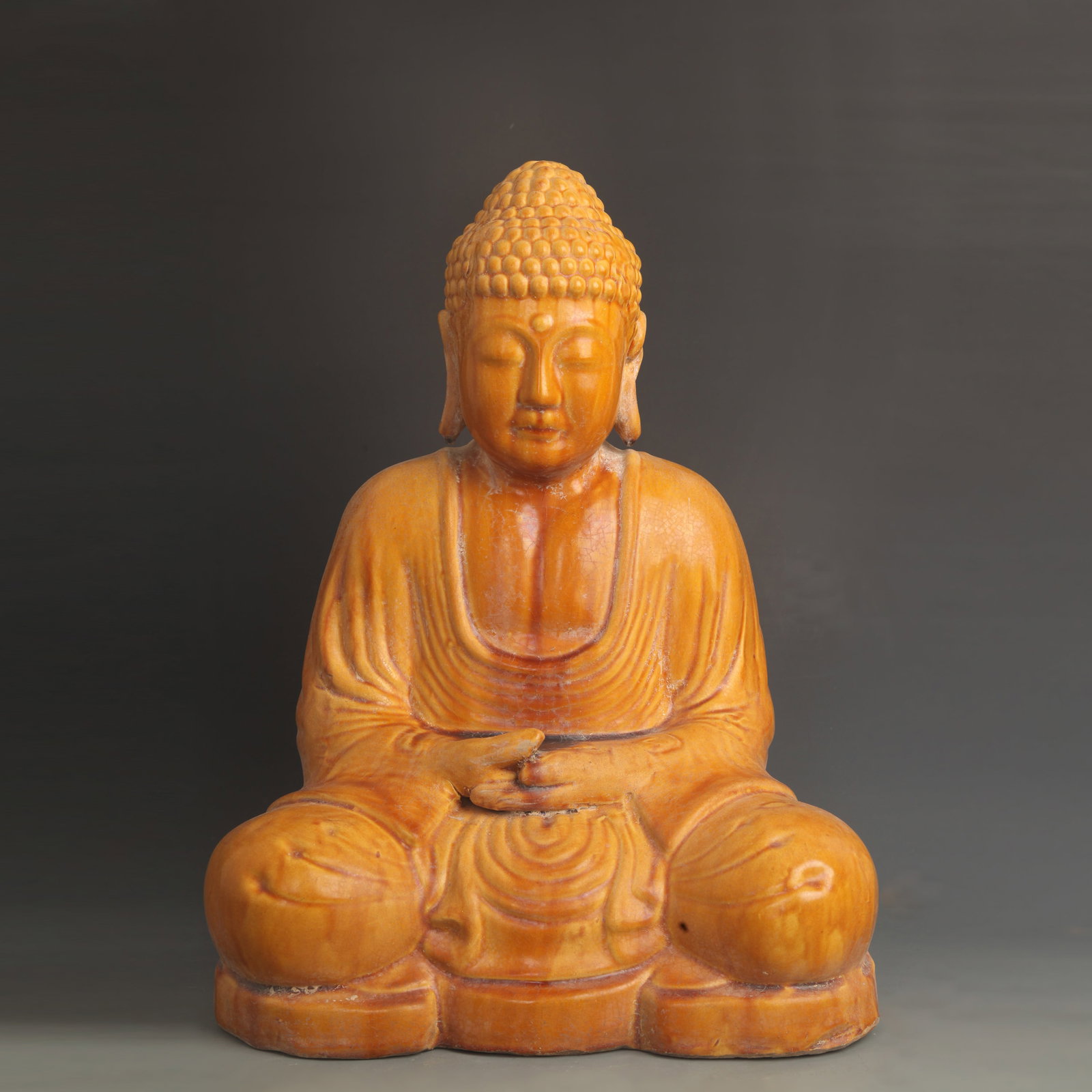 RED POTTERY WITH YELLOW GLAZE SHAKYAMUNI BUDDHA STATUE: Han Dynasty Style; High: 15.5 inch; Width: 11.0 inch; Woodbase for picture and display only
