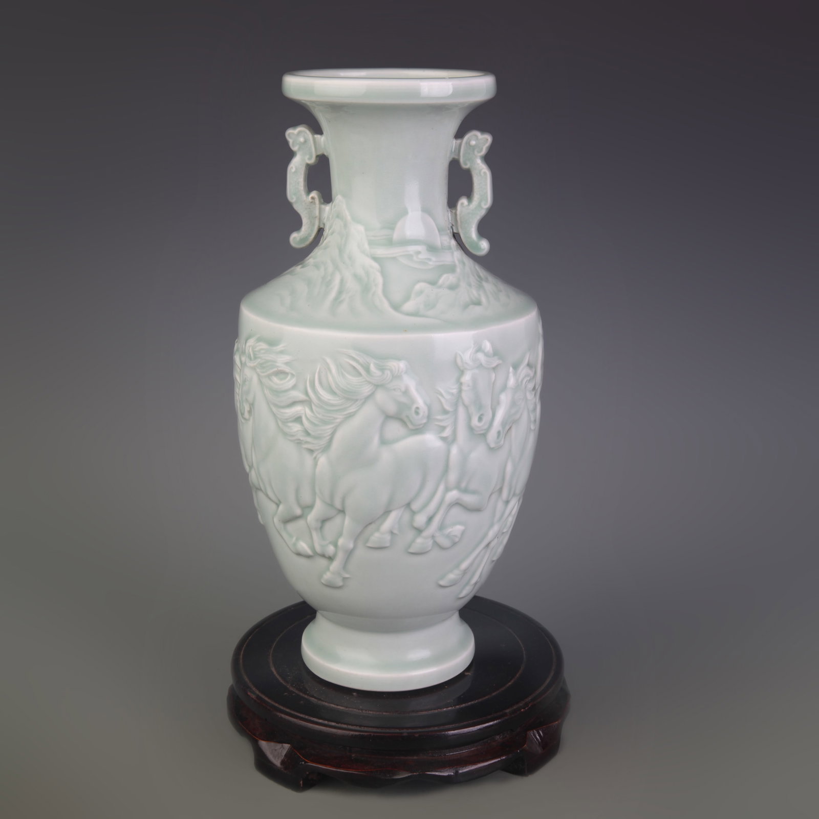LIGHT BLUE GLAZE EIGHT HORSE PATTERN DOUBLE-EARED PORCELAIN VASE: Qing Dynasty Qian Long Period; Diameter: 3.8 inch; High: 11.4 inch; Woodbase for picture and display only