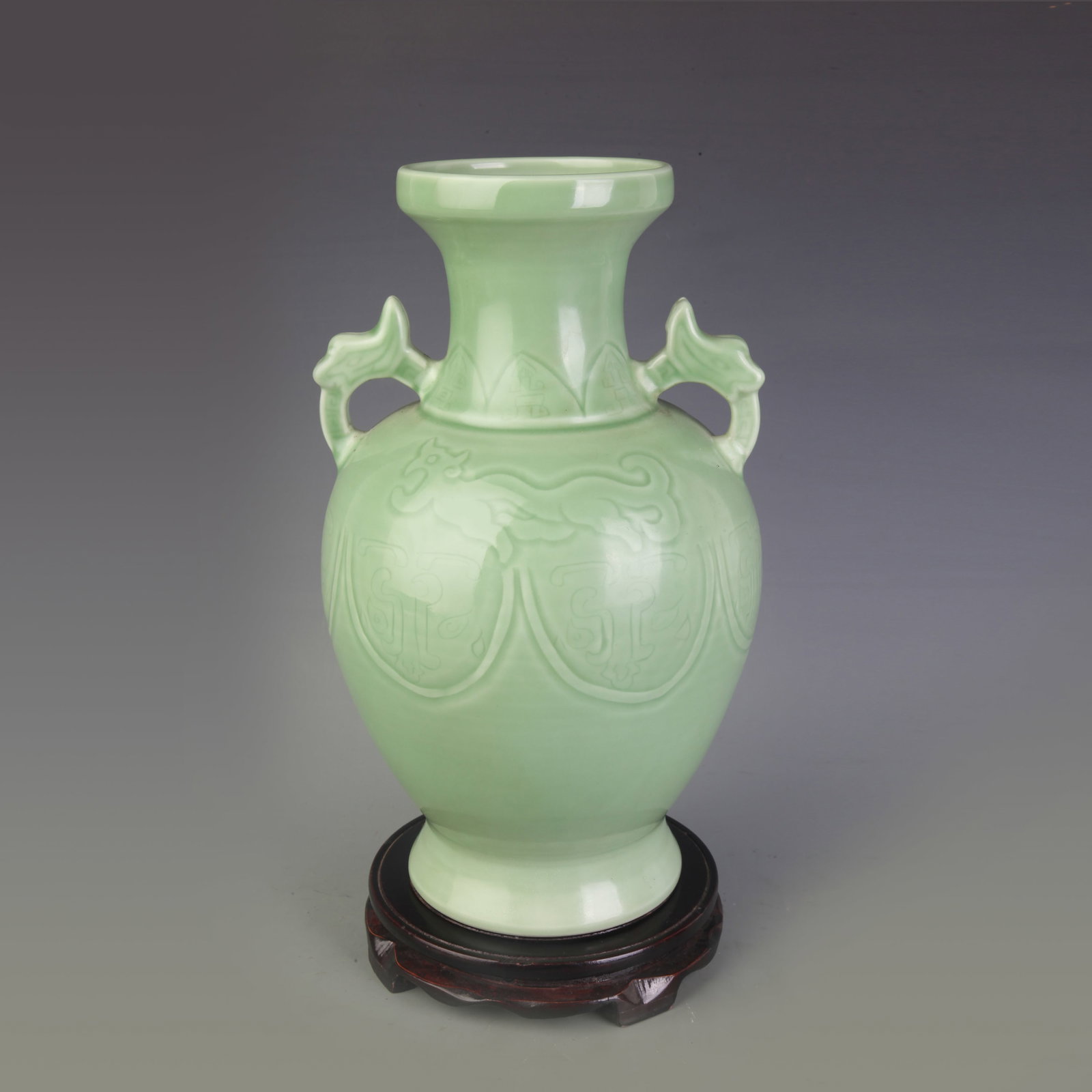 AN INCISED VASE WITH MYTHICAL BEAST MOTIF: Qing Dynasty Yong Zhen Period; Diameter: 4.5inch, High: 13.1inch; Woodbase for picture and display only