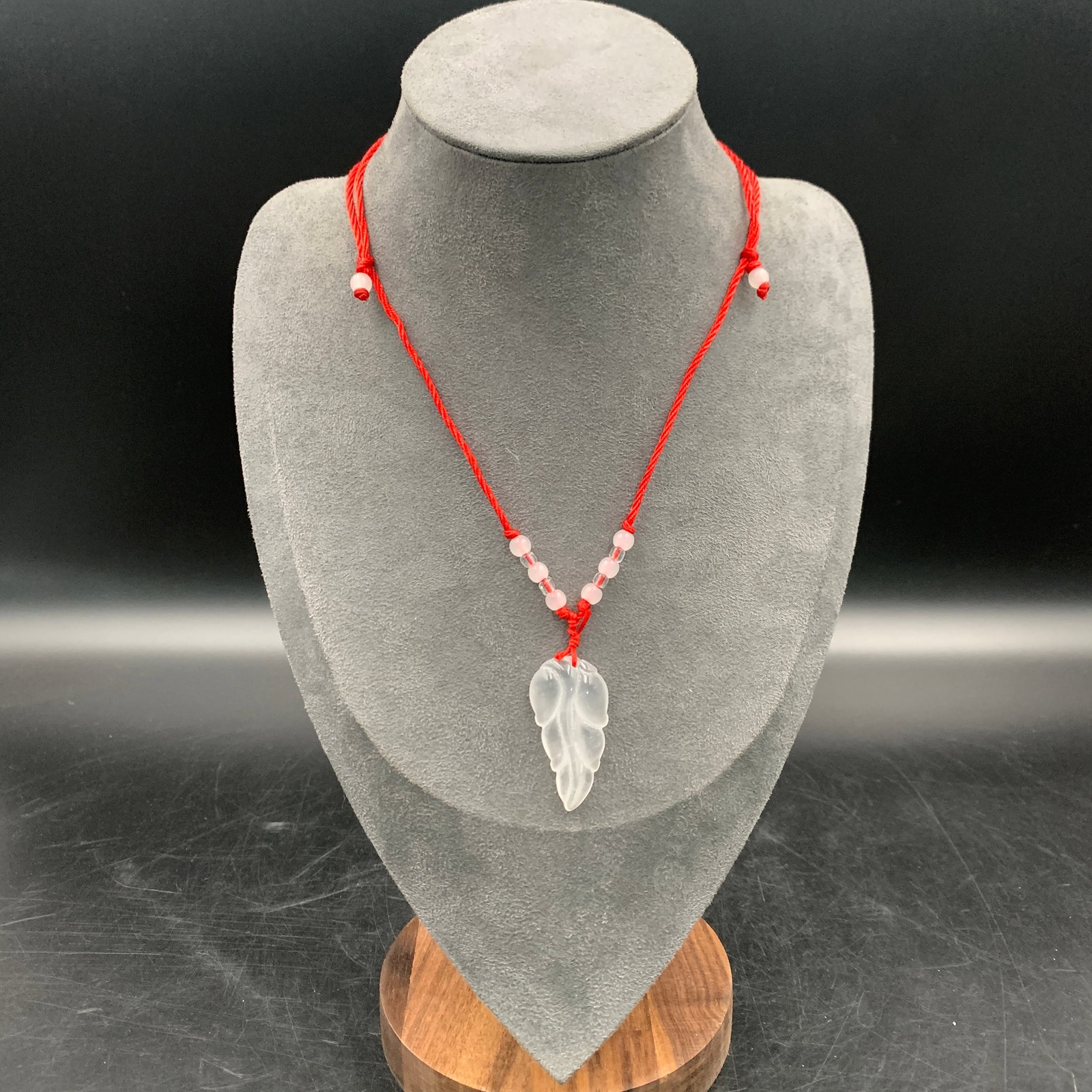 CLEAR QUARTZ "AUSPICIOUS LEAF" PENDANT NECKLACE: Modern; Long: 1.6 inch; Width: 0.8 inch; High: 0.3 inch; Woodbase for picture and display only