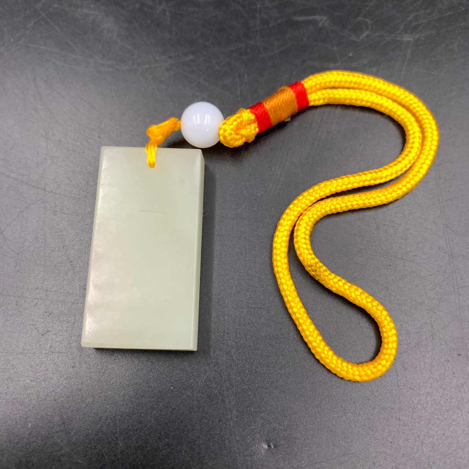 PLAIN WHITE JADEITE "WU SHI PAI" PLAQUE PENDANT: Modern; Long: 1.7 inch; Width: 0.9 inch; High: 0.3 inch; Woodbase for picture and display only