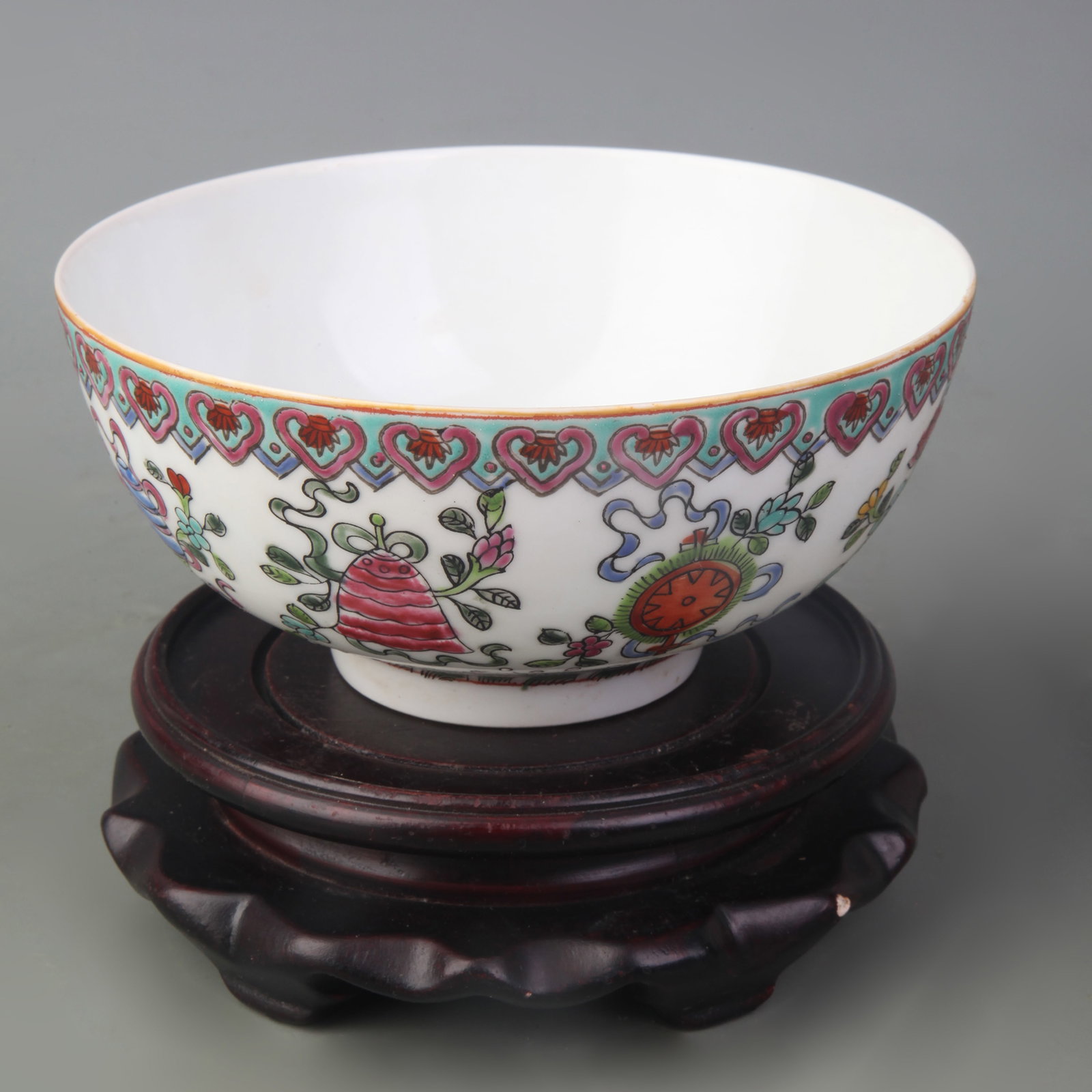 FAMILLE ROSE BOWL WITH EIGHT BUDDHIST EMBLEMS: Qing Dynasty; Diameter: 5.5inch, High: 2.5inch; Woodbase for picture and display only